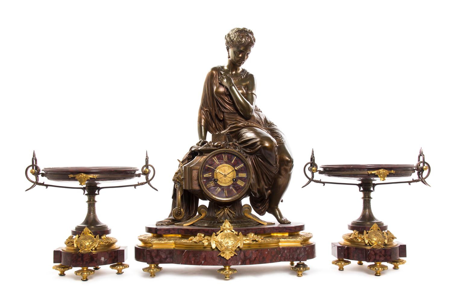 A French Rouge Marble, Gilt and Patinated Bronze Three-Piece Clock Garniture, retailed by H. Pallenberg, Cologne, Height of clock 26 in
