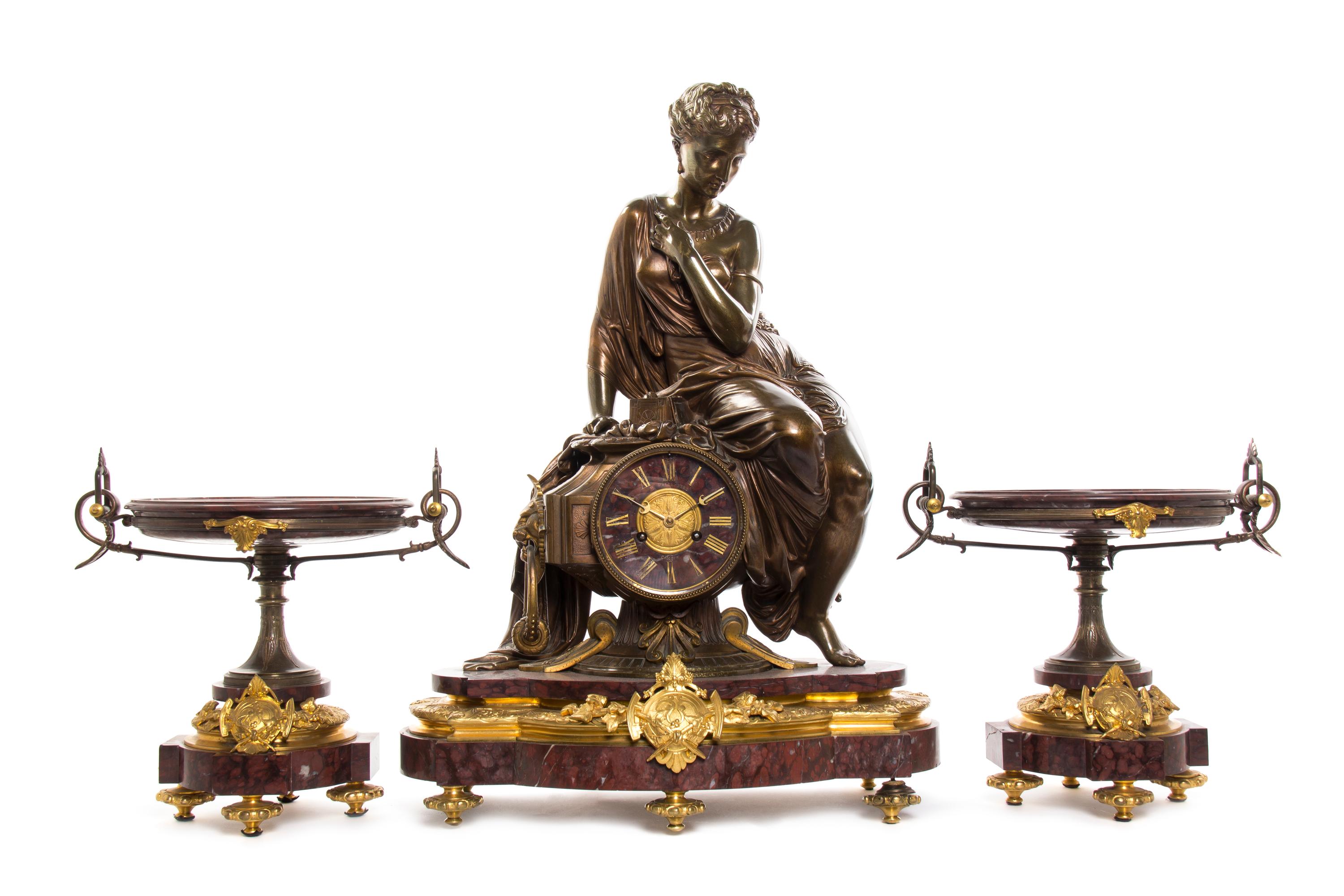 A French Rouge Marble, Gilt and Patinated Bronze Three-Piece Clock Garniture, retailed by H. Pallenberg, Cologne, Height of clock 26 in