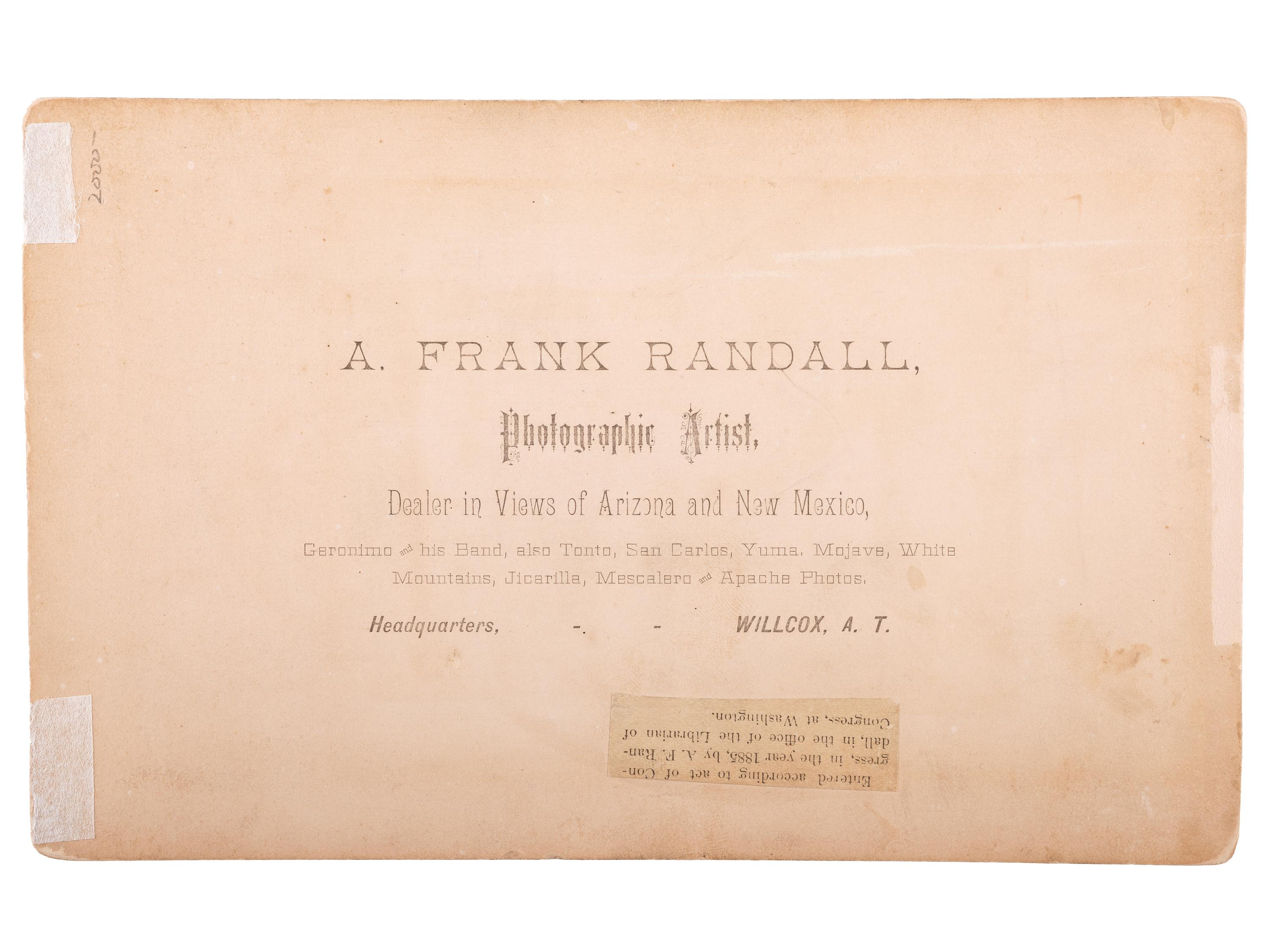 [NATIVE AMERICANS]. RANDALL, A. Frank, photographer. Boudoir card of Geronimo kneeling, holding an 1873 Springfield carbine rifle. Wilcox, Arizona Territory: 1885.