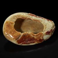 A Chinese carved russet and beige jade "Lotus Leaf" brush washer 赤褐色沁灰玉莲叶水洗