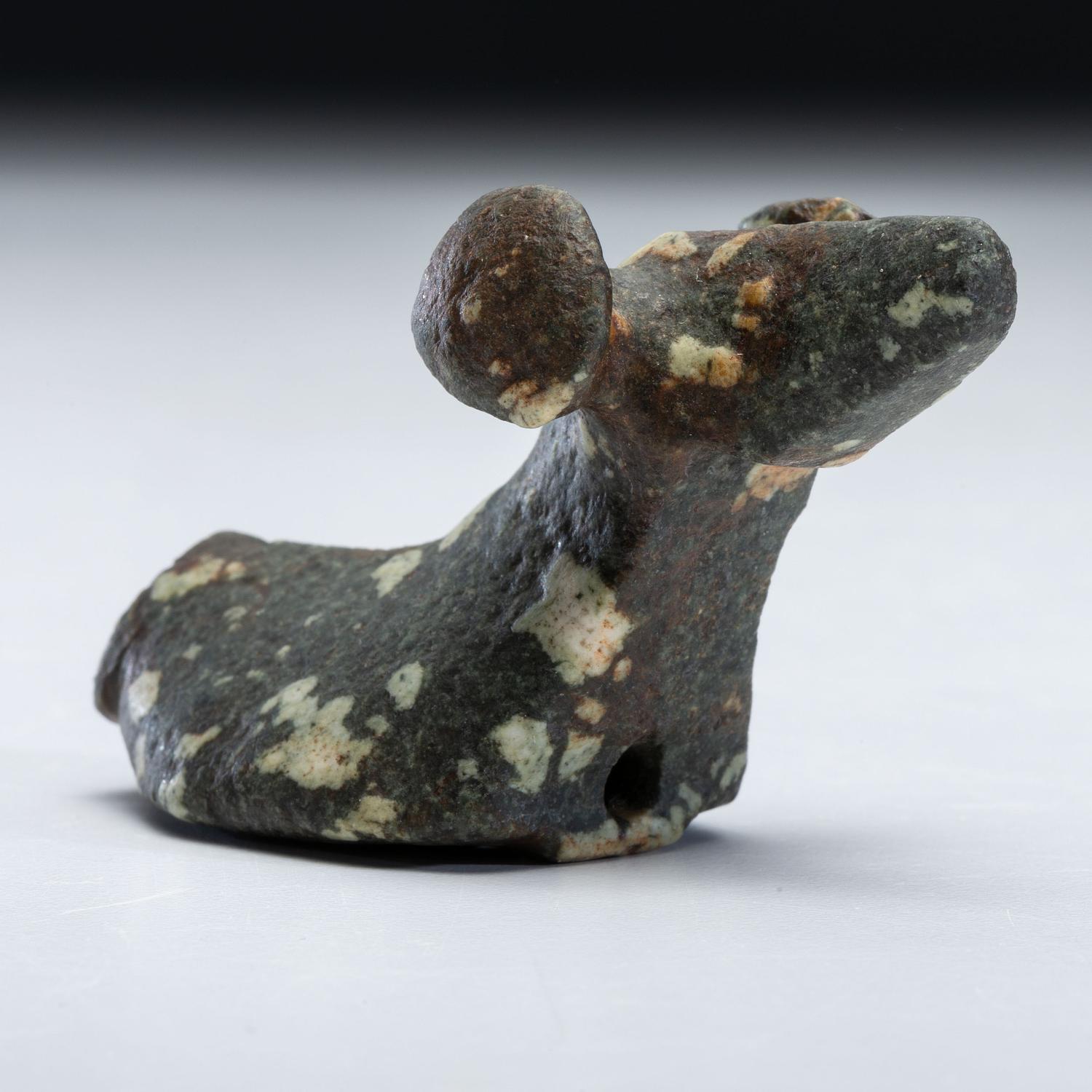 A Salvaged Porphyry Popeye Birdstone, with Red Ocher