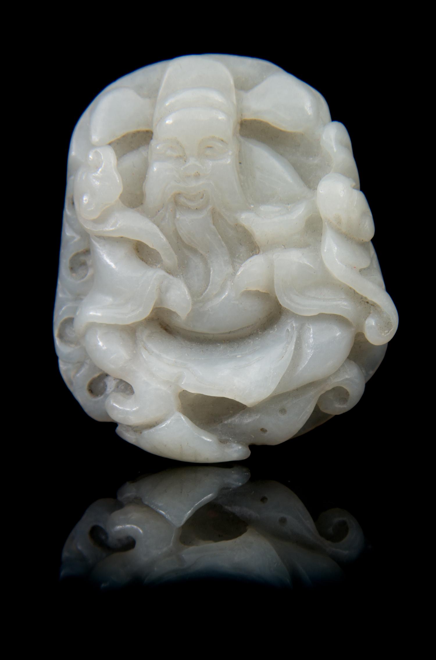 A Carved Jade Toggle Length 2 1/4 inches.