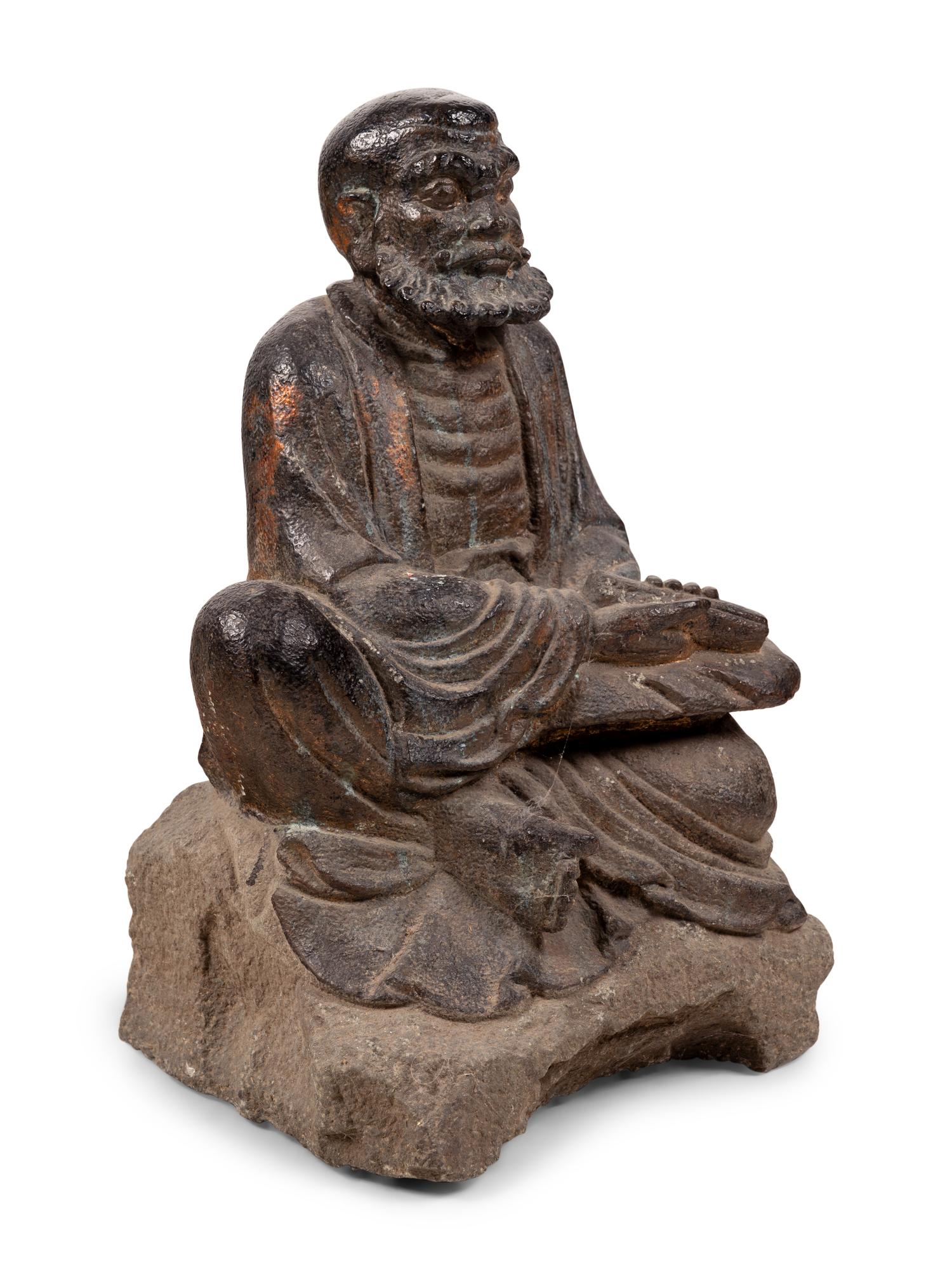 A Chinese Carved Stone Seated Figure