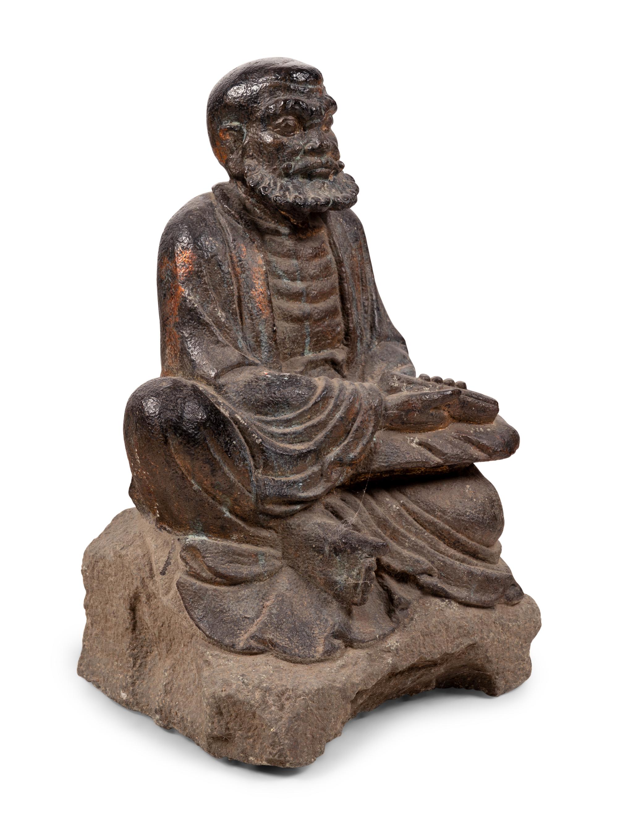 A Chinese Carved Stone Seated Figure