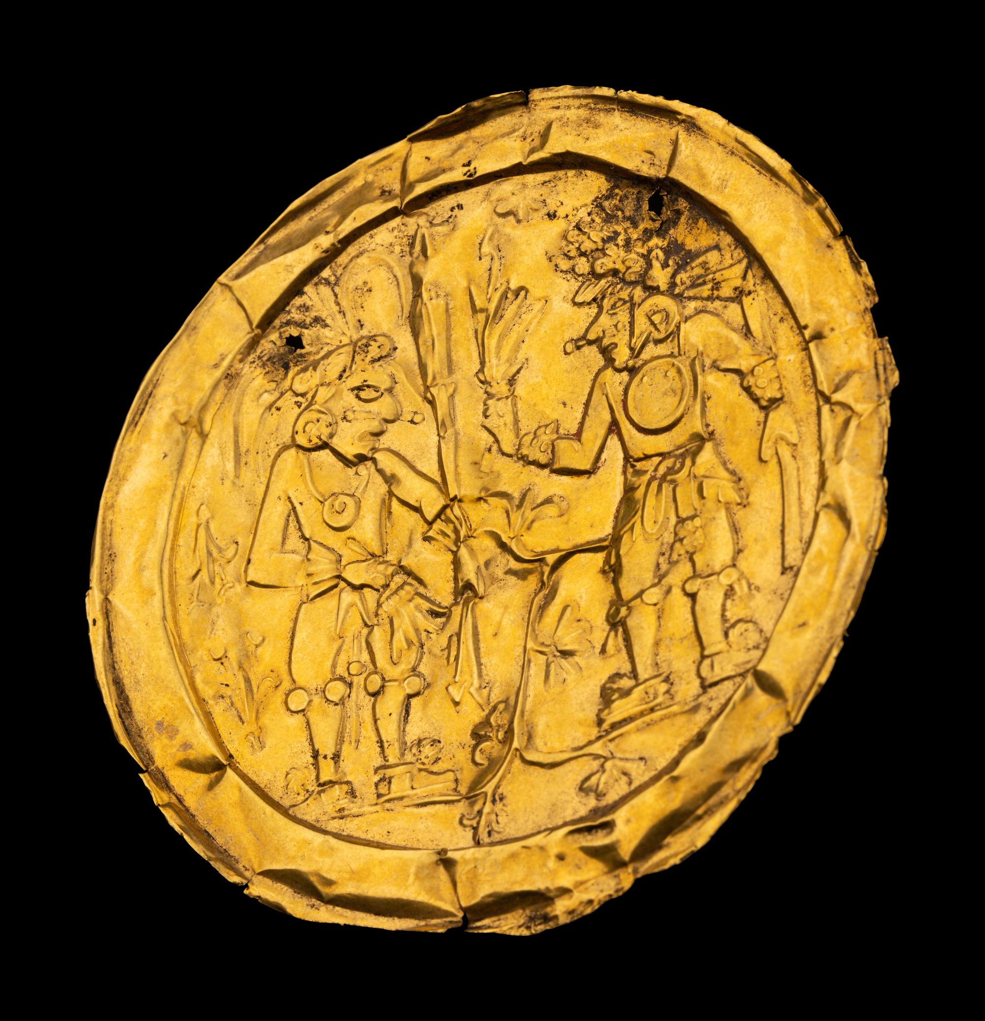 An Aztec or Toltec Gold Embossed Disc