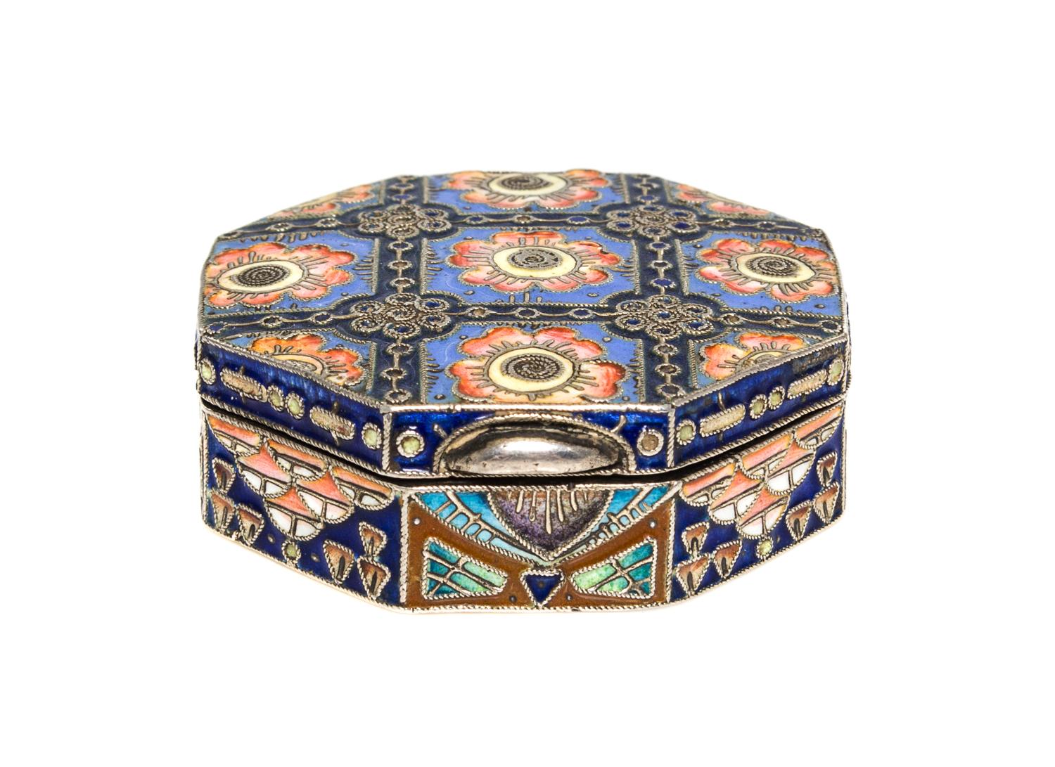A Russian Enameled Silver Pill Box, 11th Artel, Moscow, 1908-1926, of octagonal fom with polychrome floral decoration.