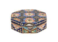 A Russian Enameled Silver Pill Box, 11th Artel, Moscow, 1908-1926, of octagonal fom with polychrome floral decoration.