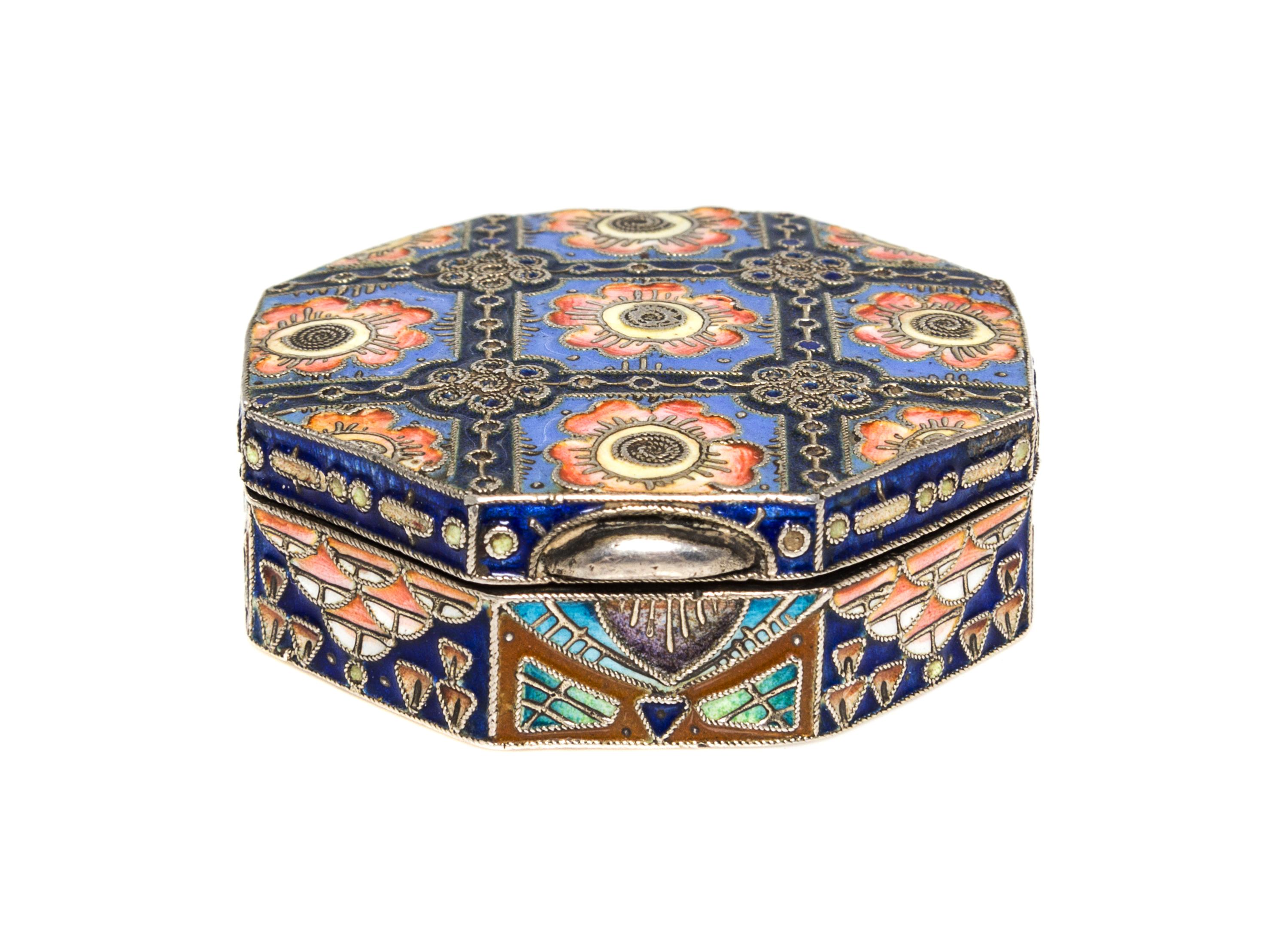 A Russian Enameled Silver Pill Box, 11th Artel, Moscow, 1908-1926, of octagonal fom with polychrome floral decoration.