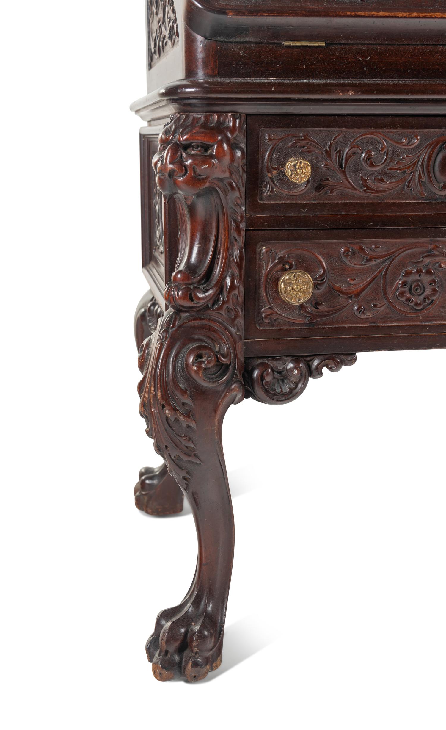 A Renaissance Revival Carved Mahogany Slant-Front Bureau