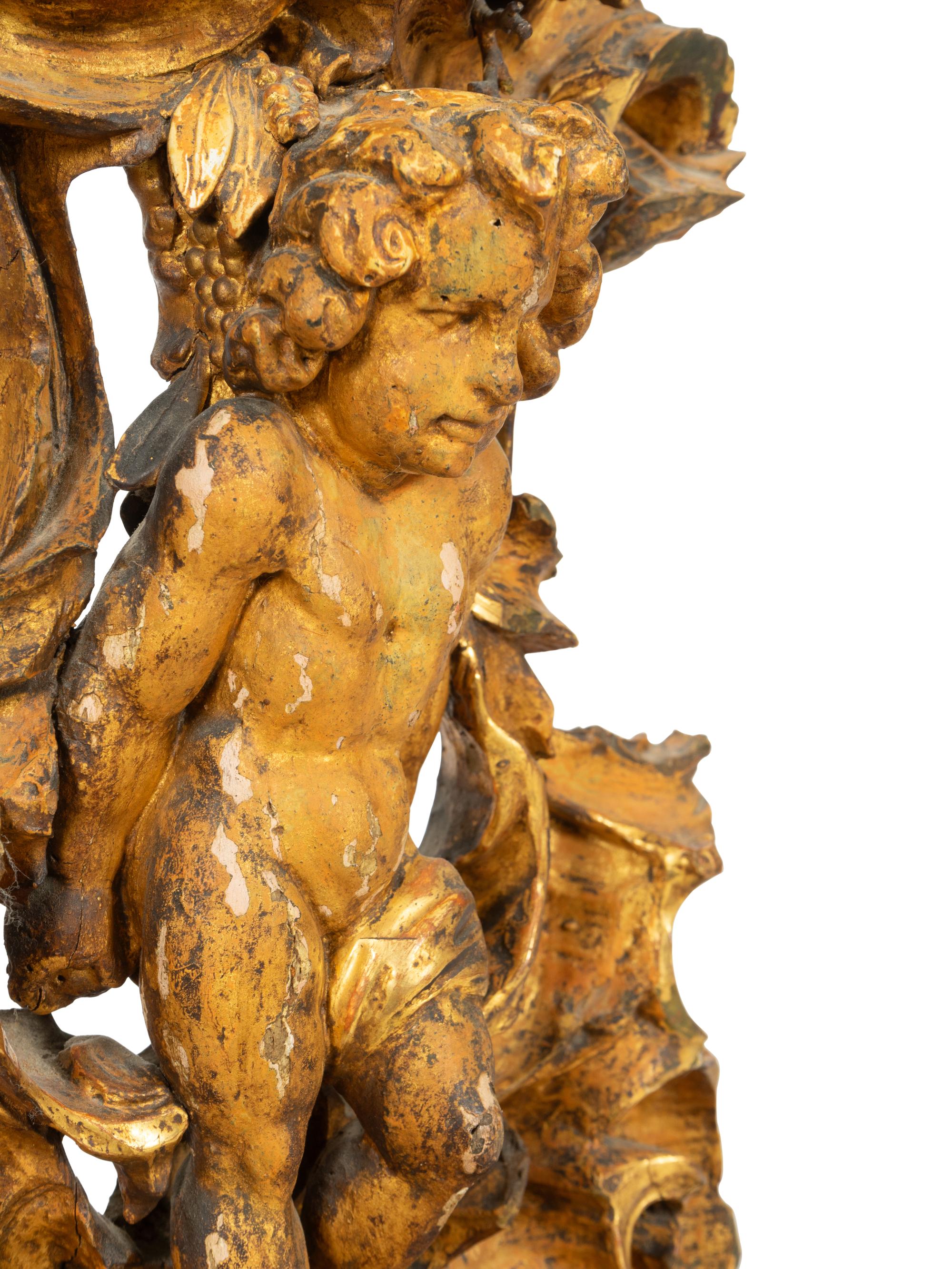 A Continental Carved, Painted and Parcel-Gilt Figural Clock