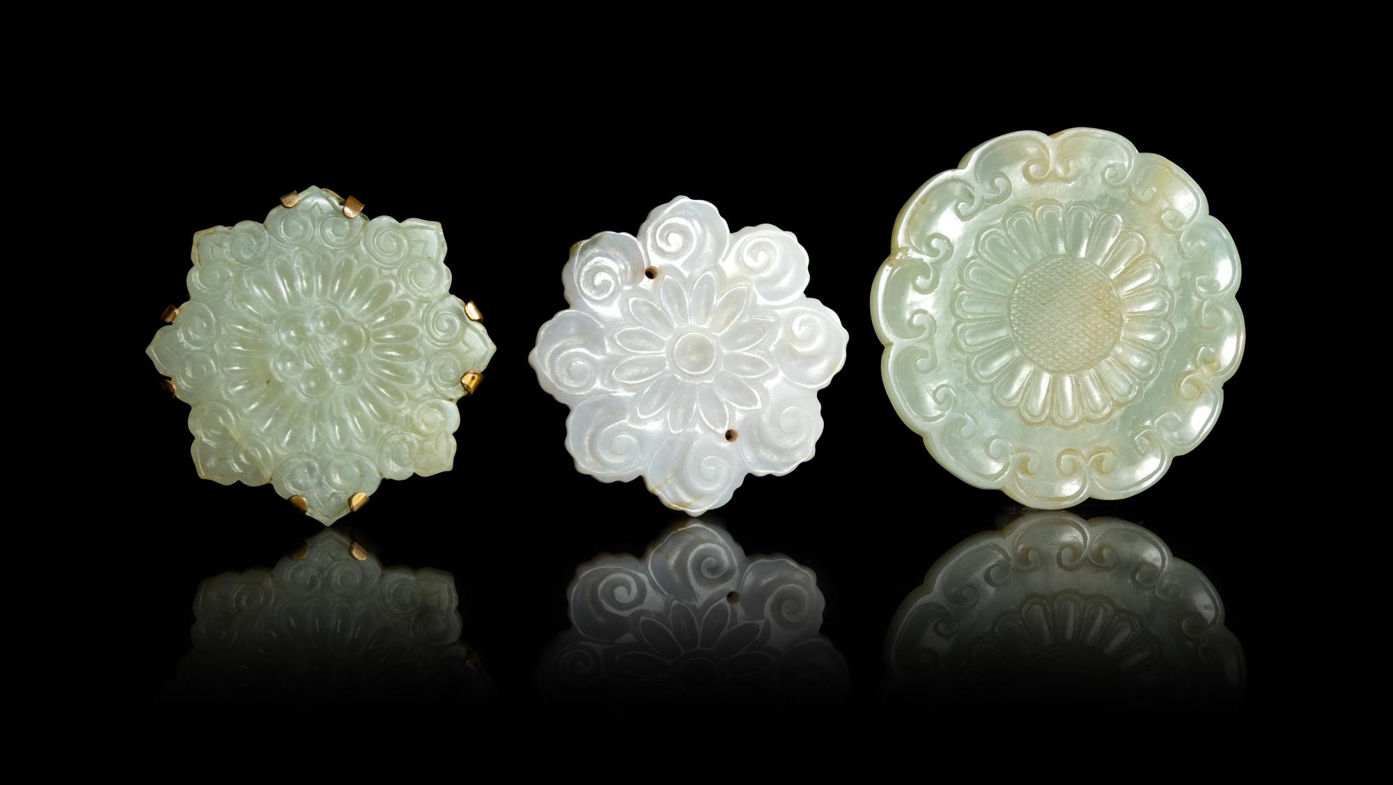 Three Celadon Jade Floriform Pendants