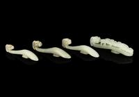 Four Chinese Celadon Jade 'Chilong' Belt Hooks