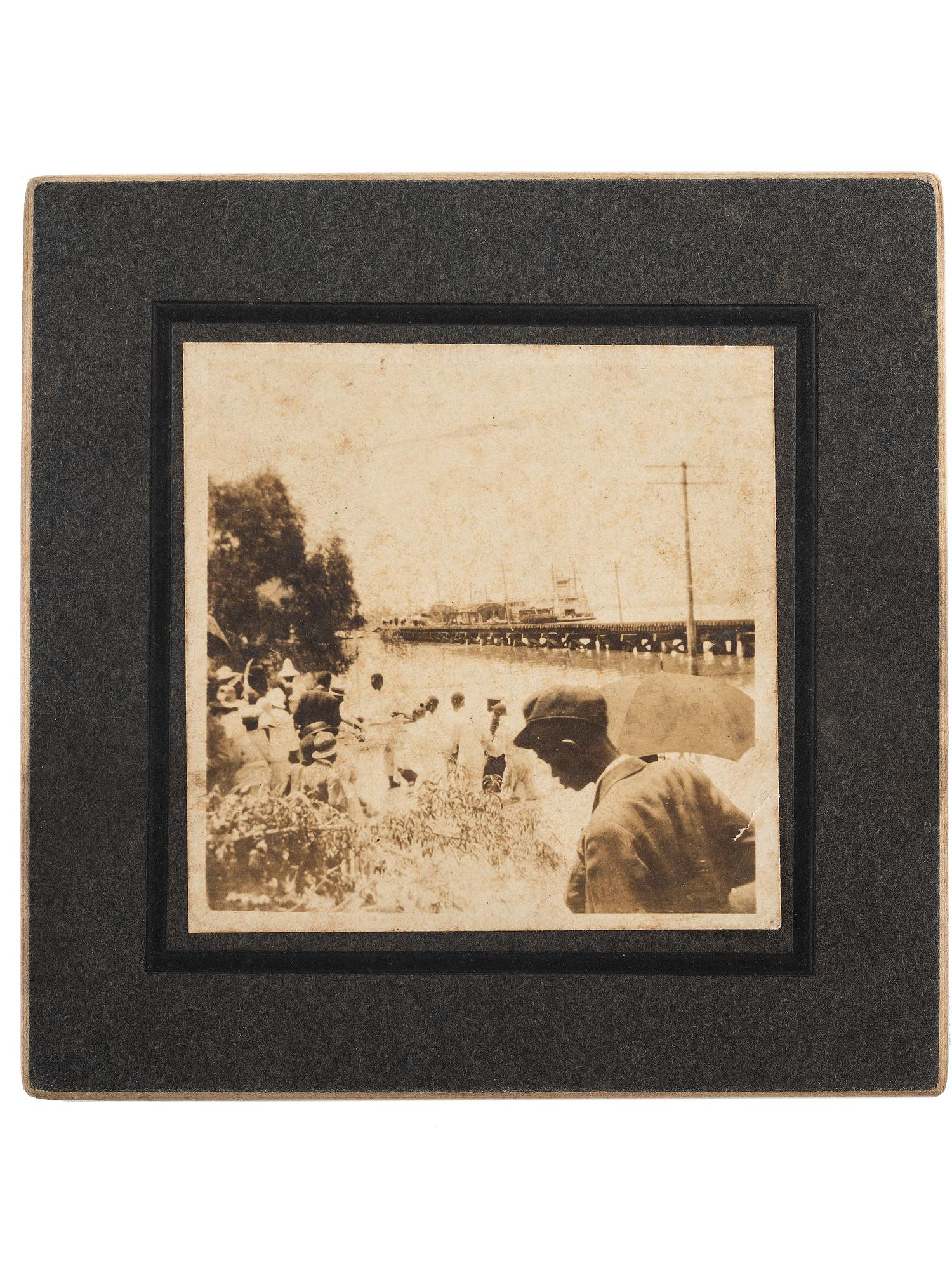 [EARLY PHOTOGRAPHY] -- [RELIGION]. Snapshot of a river baptism featuring a large group of African American subjects. [Mississippi], ca early 1900s.