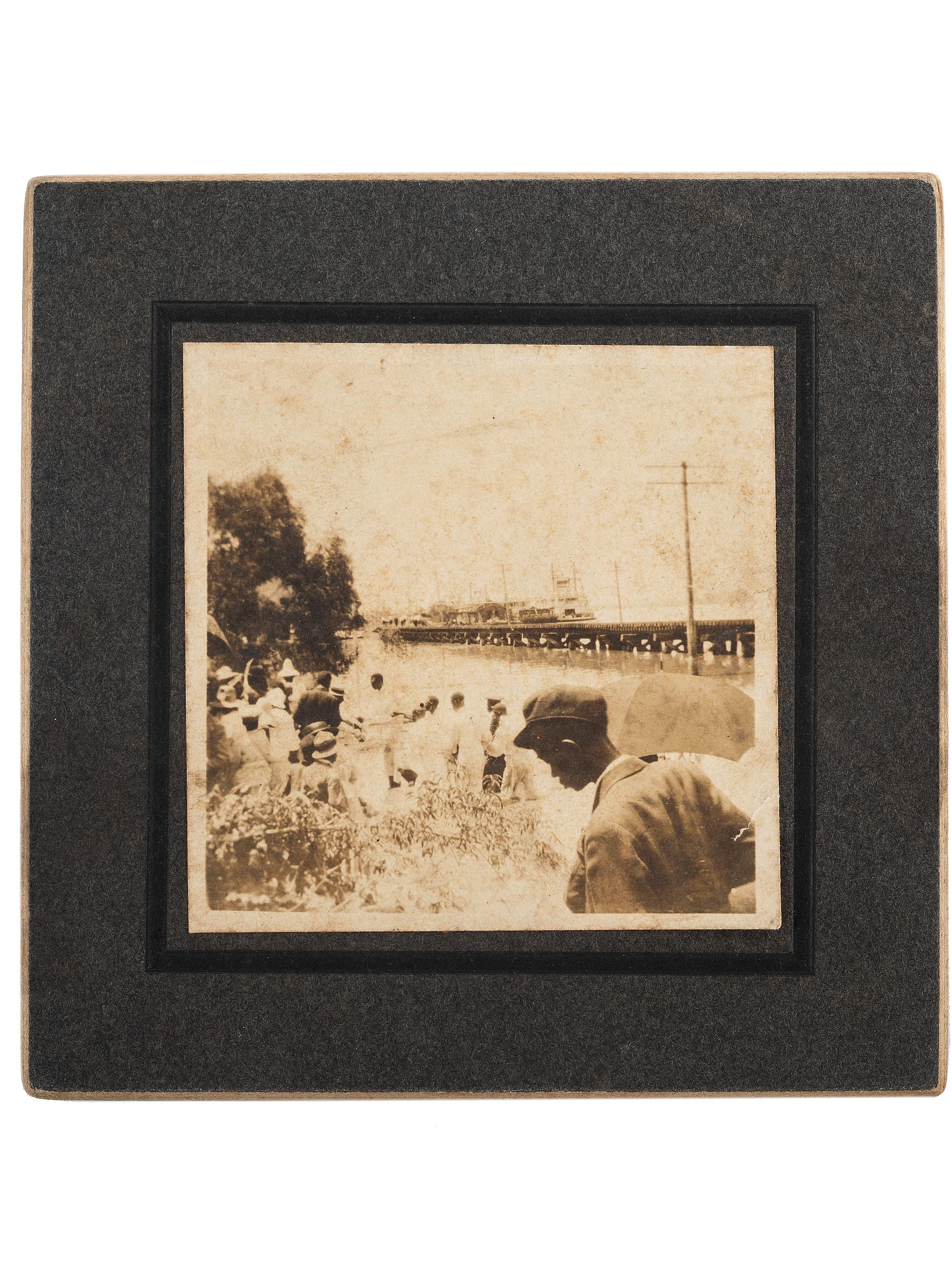 [EARLY PHOTOGRAPHY] -- [RELIGION]. Snapshot of a river baptism featuring a large group of African American subjects. [Mississippi], ca early 1900s.