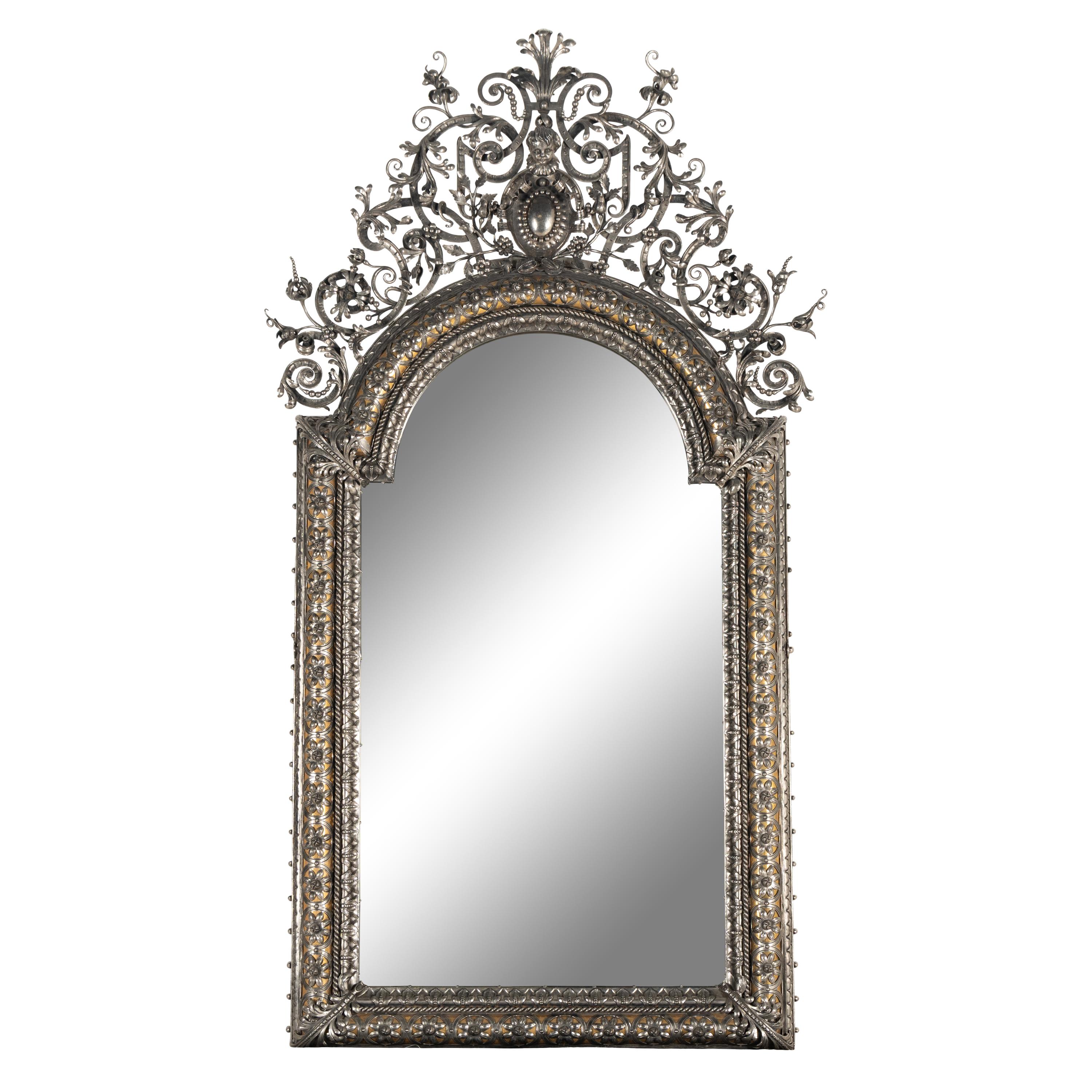 A Baroque Style Silvered Wrought Iron Mirror