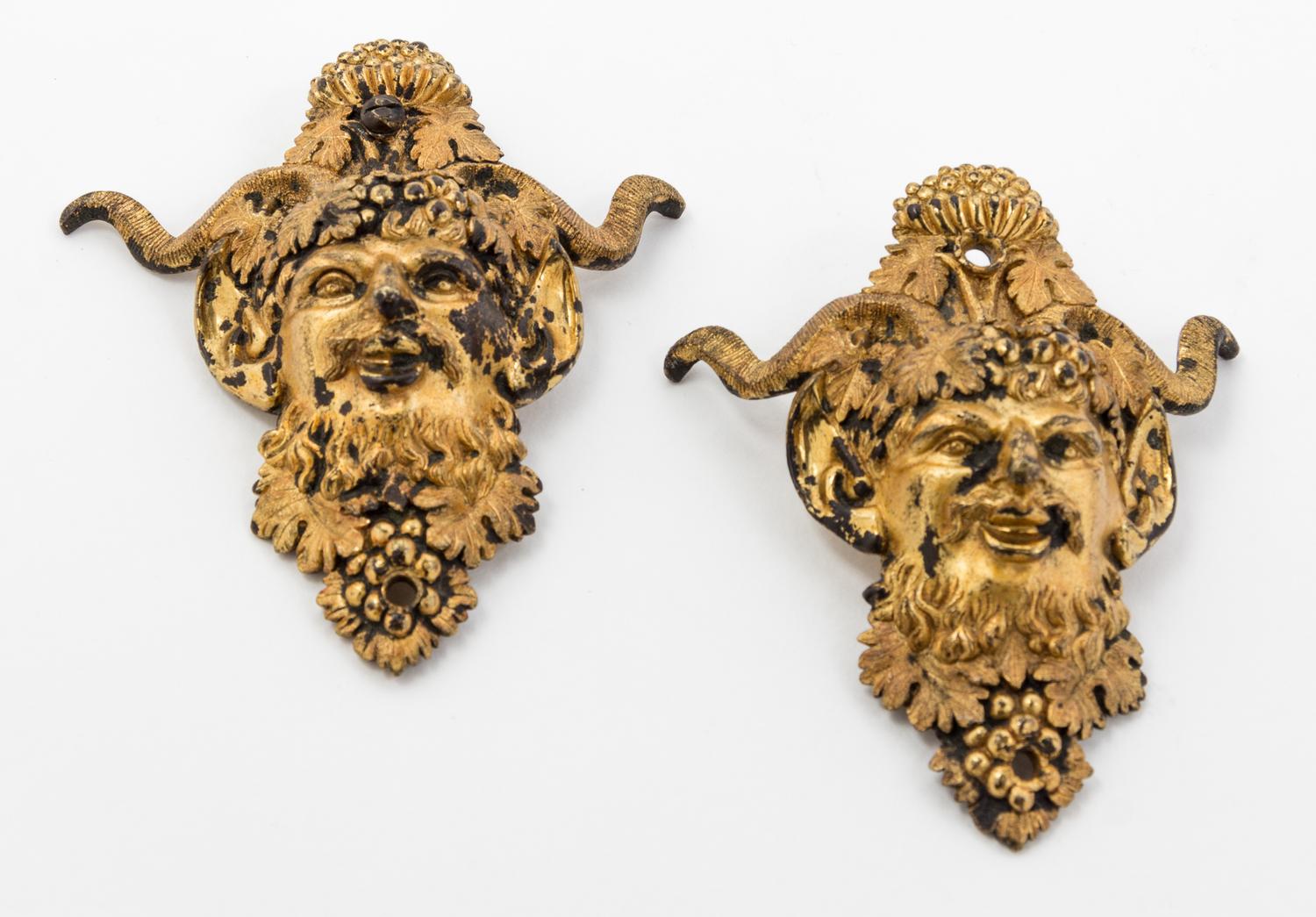 Two Gilt Metal Satyr Masks Height 4 inches.