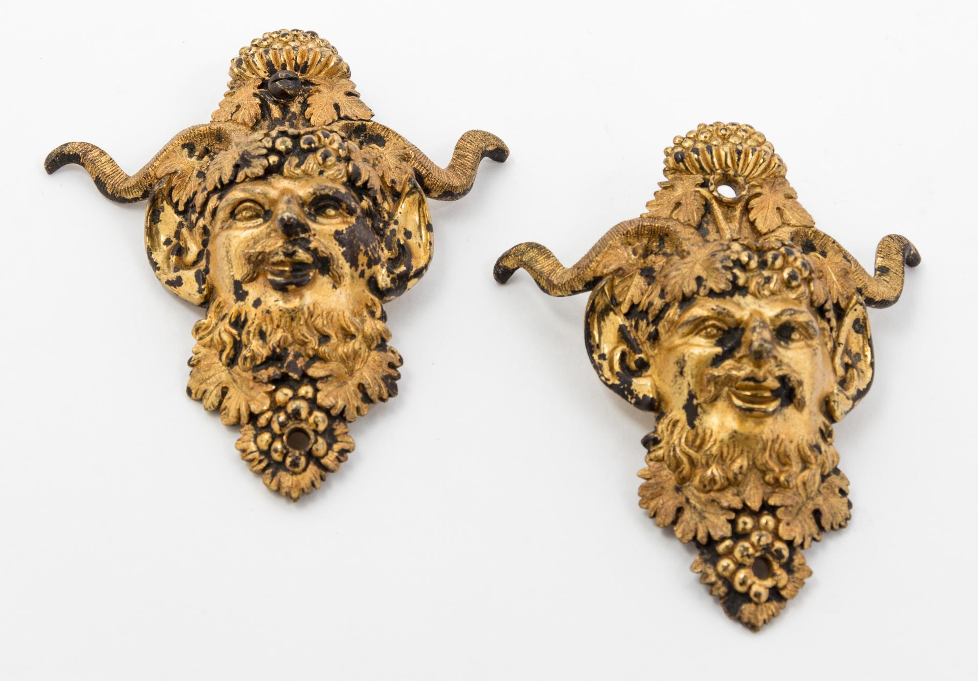 Two Gilt Metal Satyr Masks Height 4 inches.