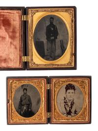 [CIVIL WAR]. 3 tintype portraits of armed soldiers housed in figural Union cases.