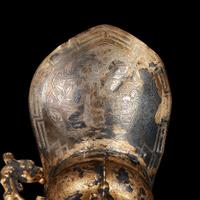 A Chinese silver-gilt tripod libation cup