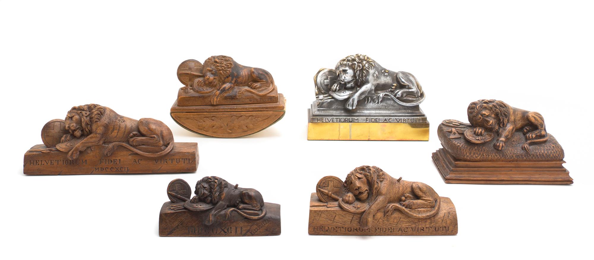 A Collection of Six Models of the Lion of Lucerne, Width of first overall 7 1/4 inches.