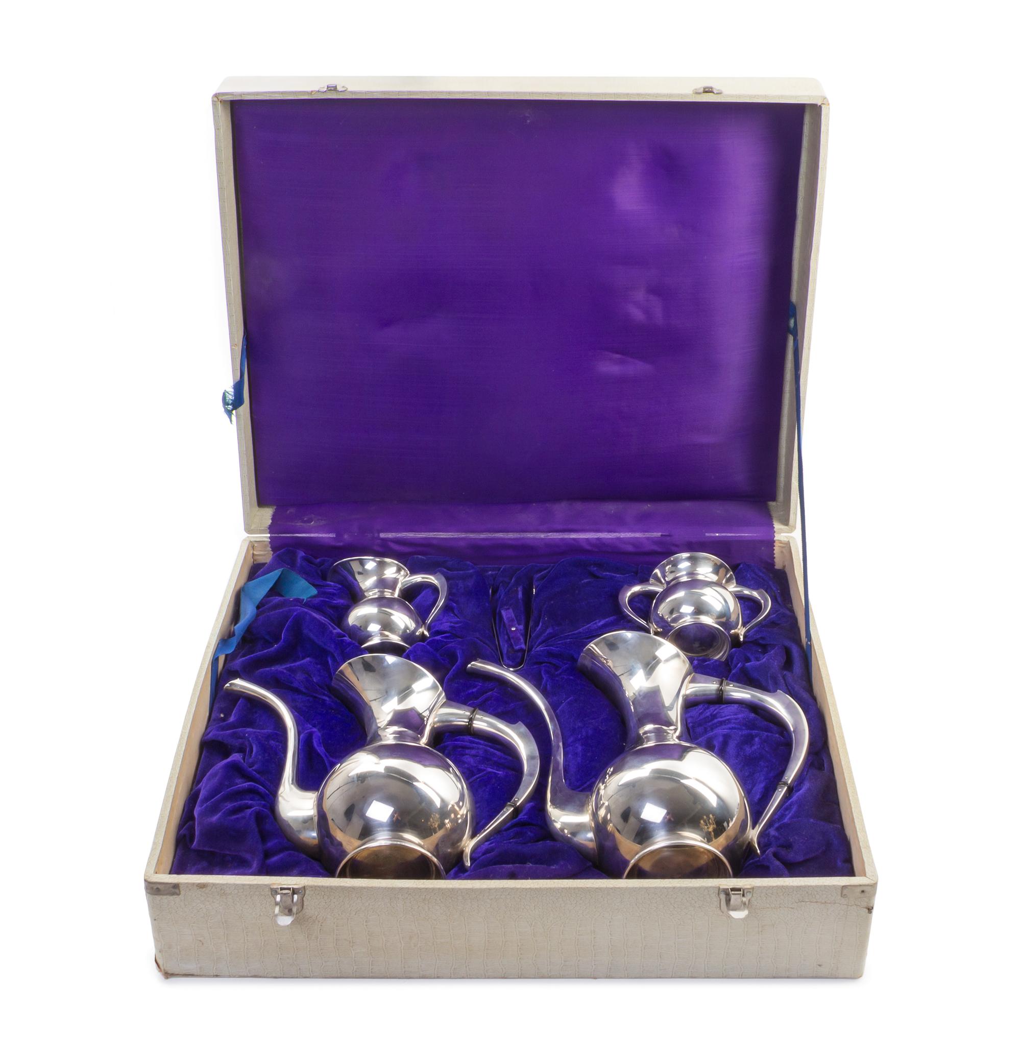 A Japanese Export Silver Four-Piece Tea and Coffee Service, 20th Century, comprising a teapot, a coffee pot, a creamer and a two-handle
