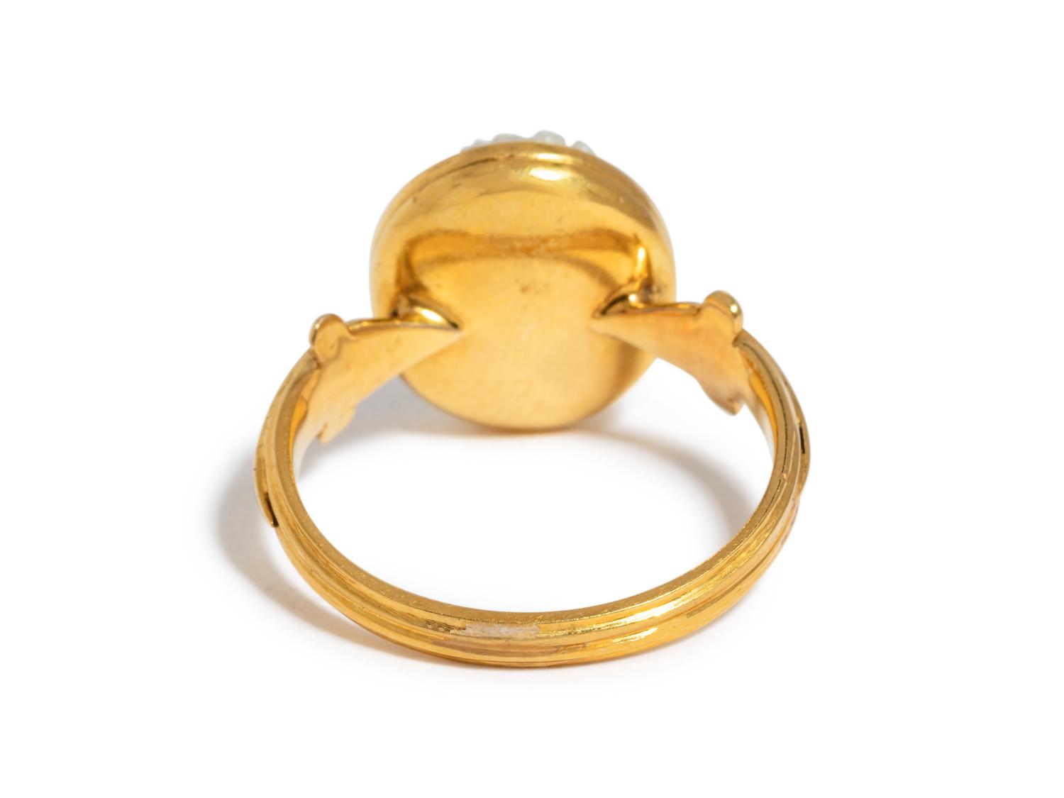A Roman Onyx Cameo Ring Stone with the Head of a Child — Set in a gold ring