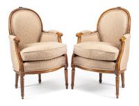A Pair of Louis XVI Style Walnut Bergeres Height 34 1/2 inches.