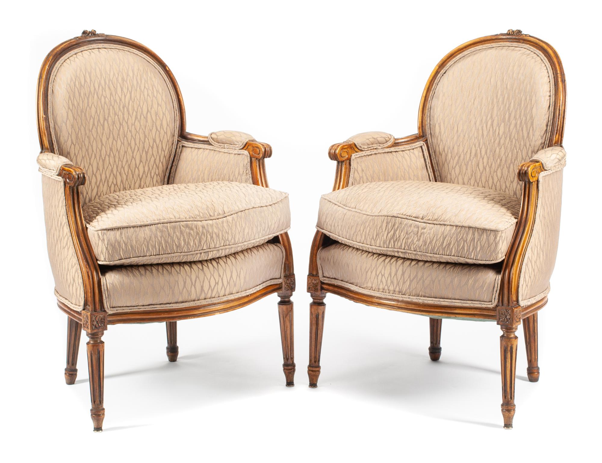 A Pair of Louis XVI Style Walnut Bergeres Height 34 1/2 inches.