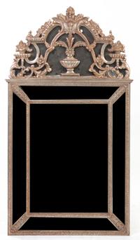 A Neoclassical Silvered Pier Mirror, Height 58 x width 32 1/2 inches.