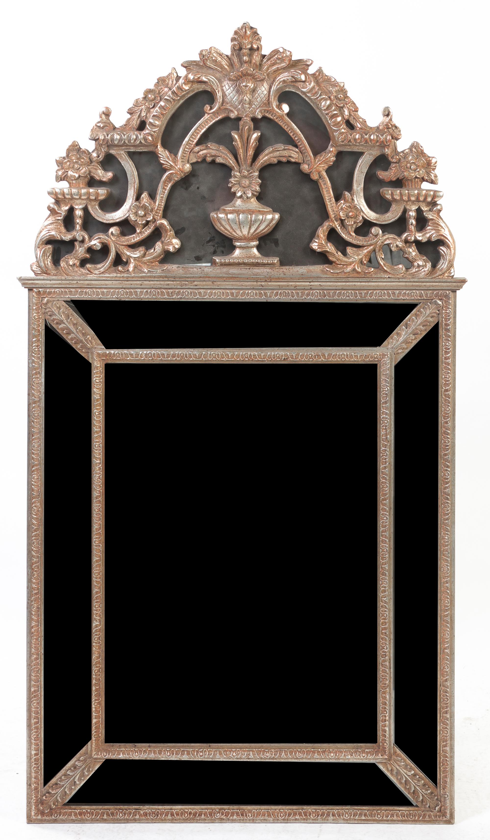 A Neoclassical Silvered Pier Mirror, Height 58 x width 32 1/2 inches.