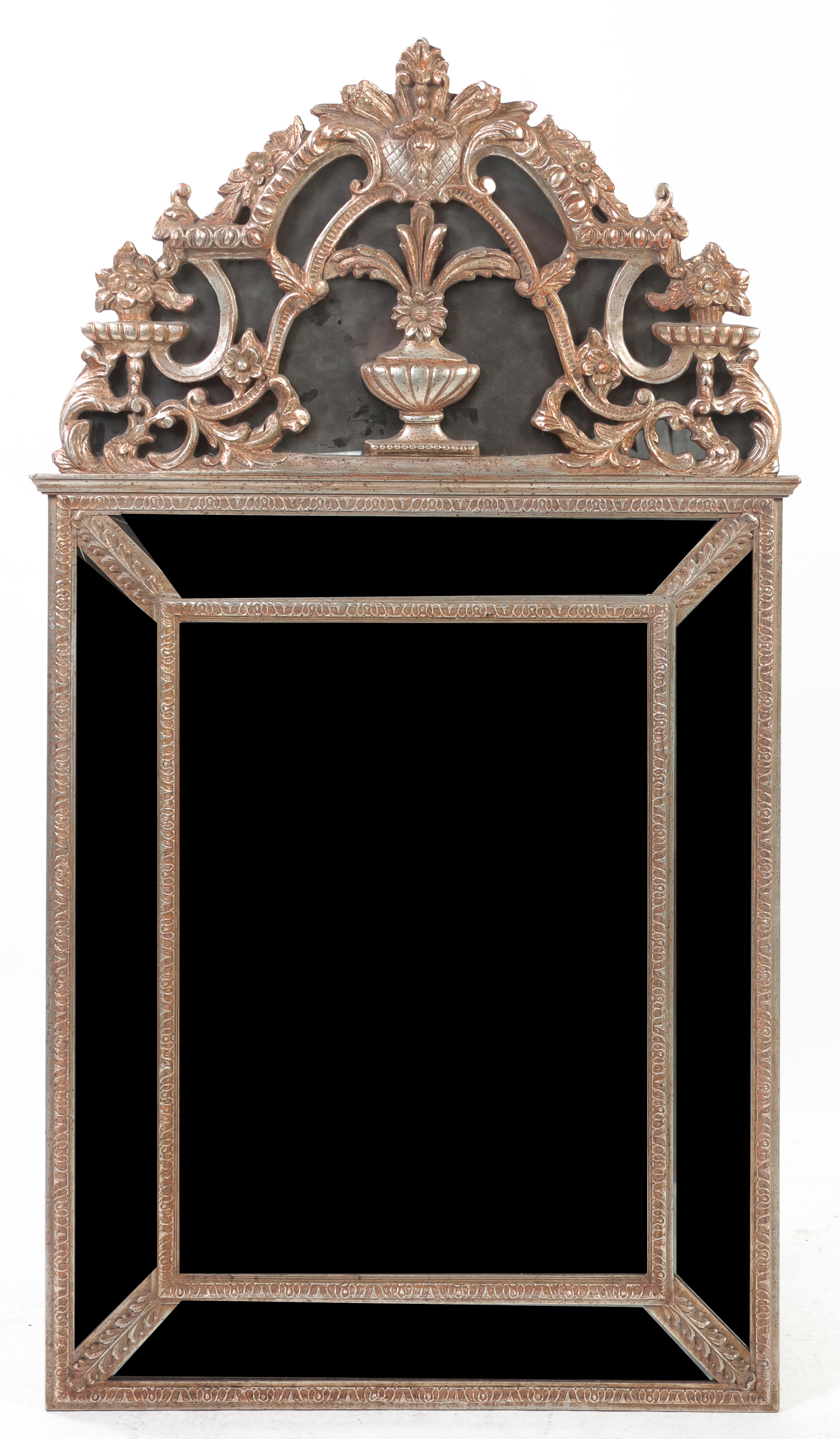 A Neoclassical Silvered Pier Mirror, Height 58 x width 32 1/2 inches.