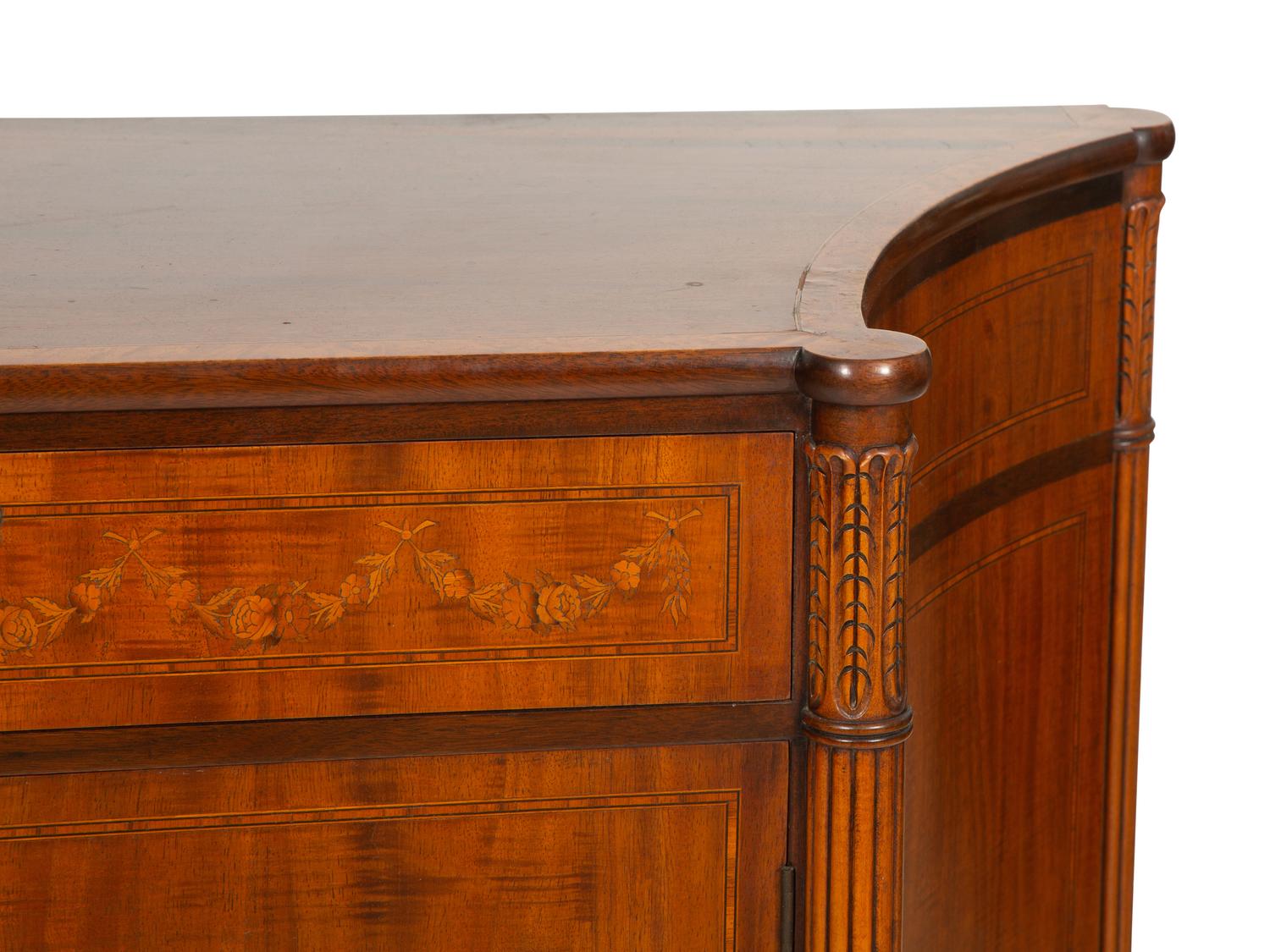A Joseph Gerte Mahogany and Marquetry Commode