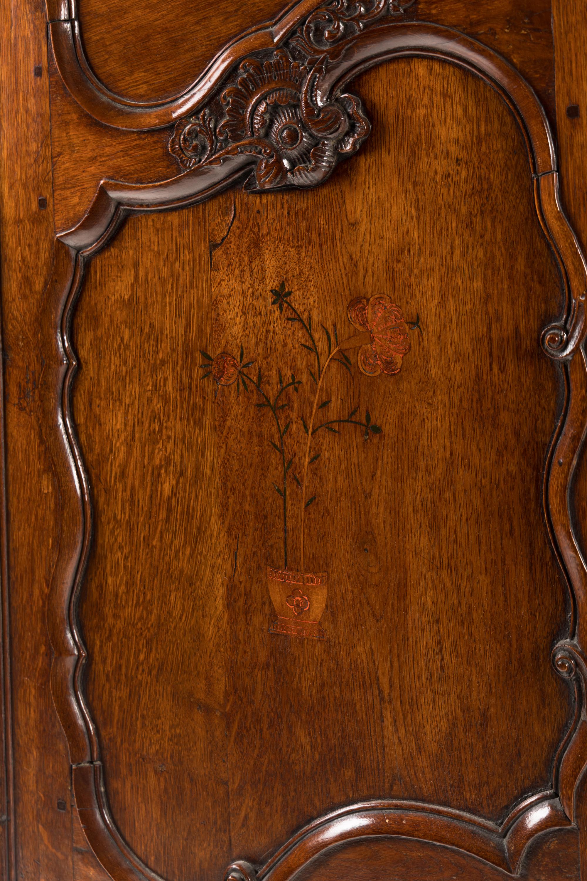 A Louis XV Walnut and Mulberry Marquetry Armoire