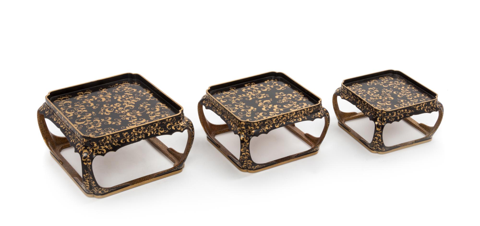 A Set of Three Japanese Gilt and Black Lacquer Stands Height of tallest 4 inches. — 20TH CENTURY