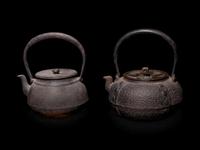 Seven Japanese Cast Iron Teapots, Tetsubin, and Burner