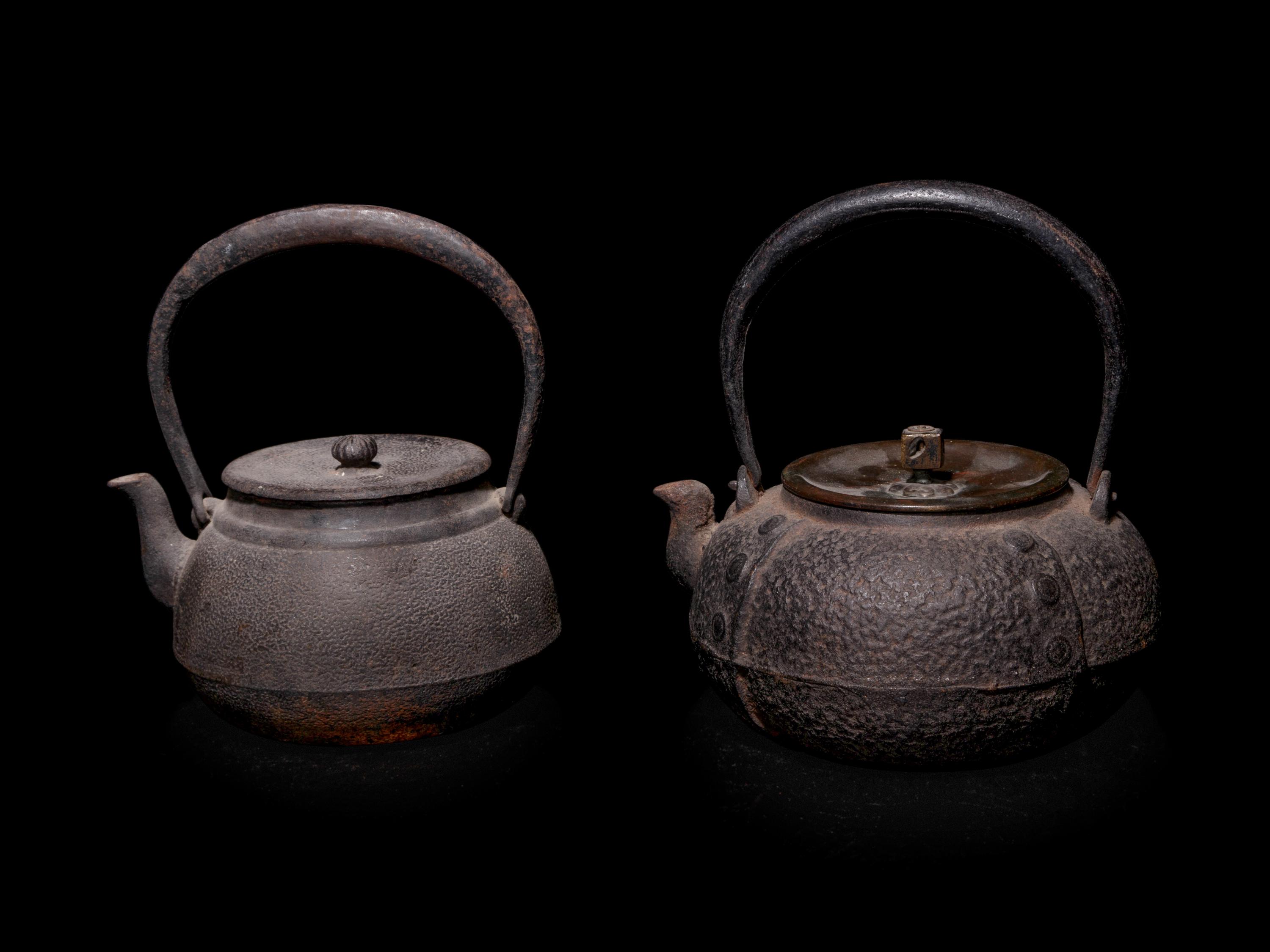 Seven Japanese Cast Iron Teapots, Tetsubin, and Burner