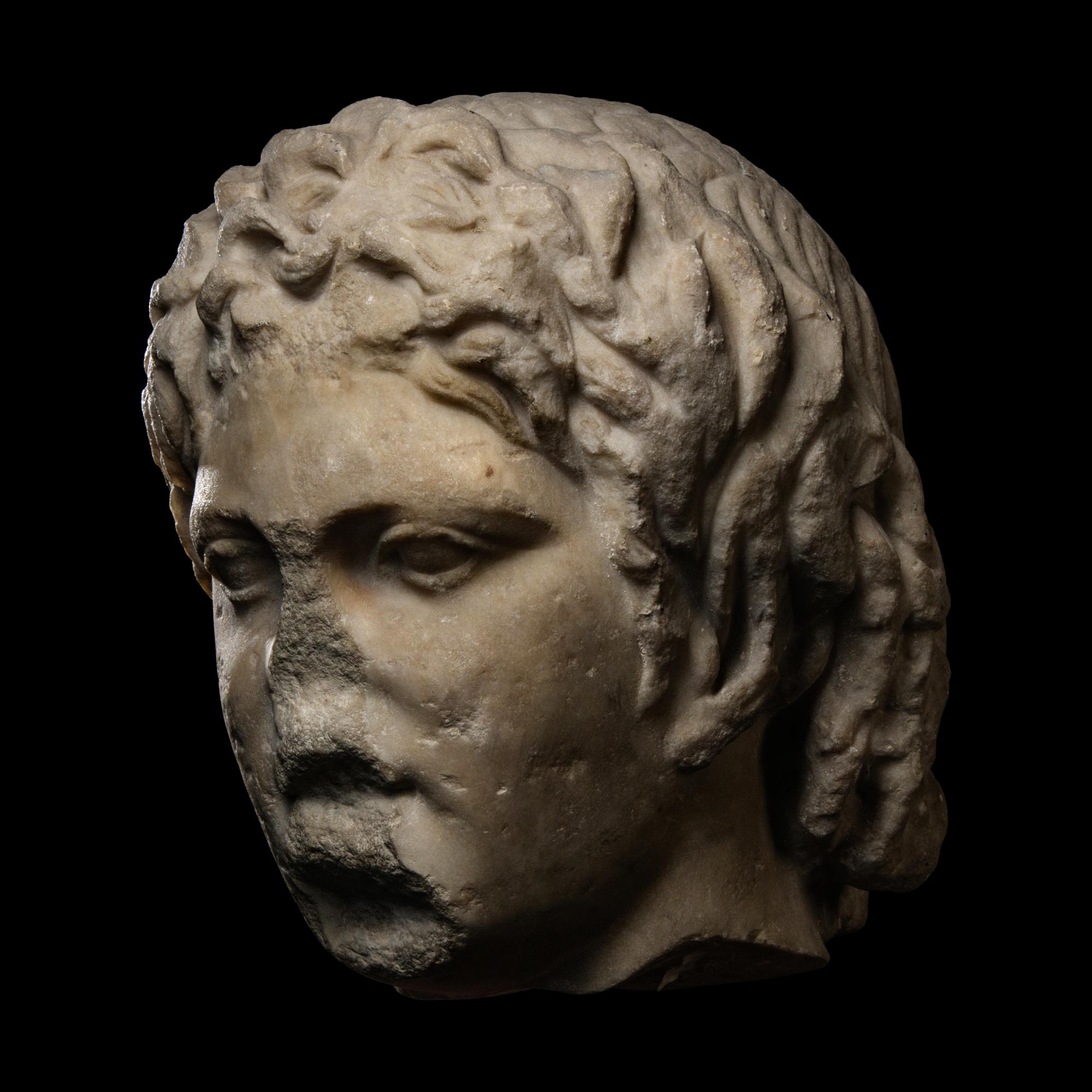 A Roman Marble Head of a Satyr