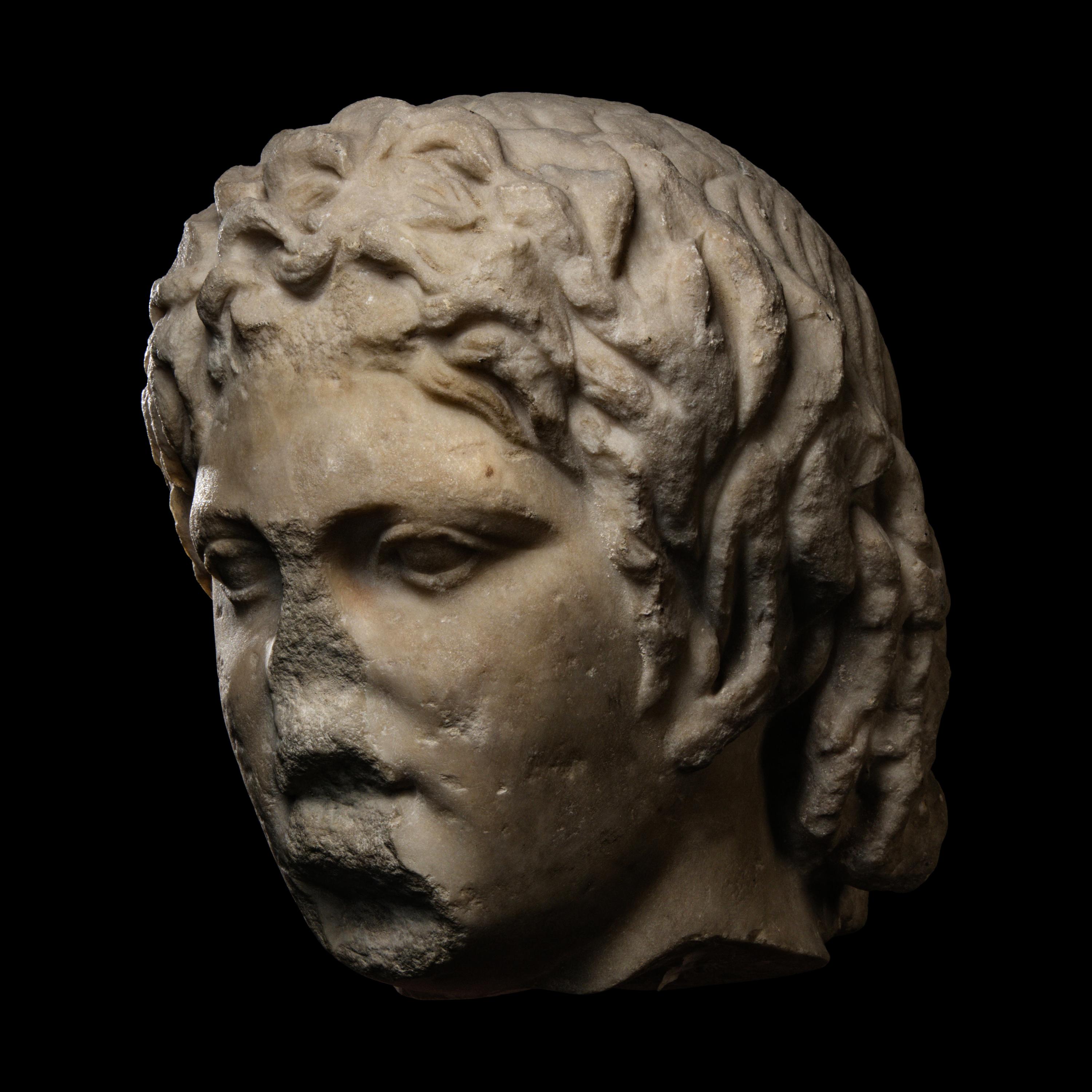 A Roman Marble Head of a Satyr