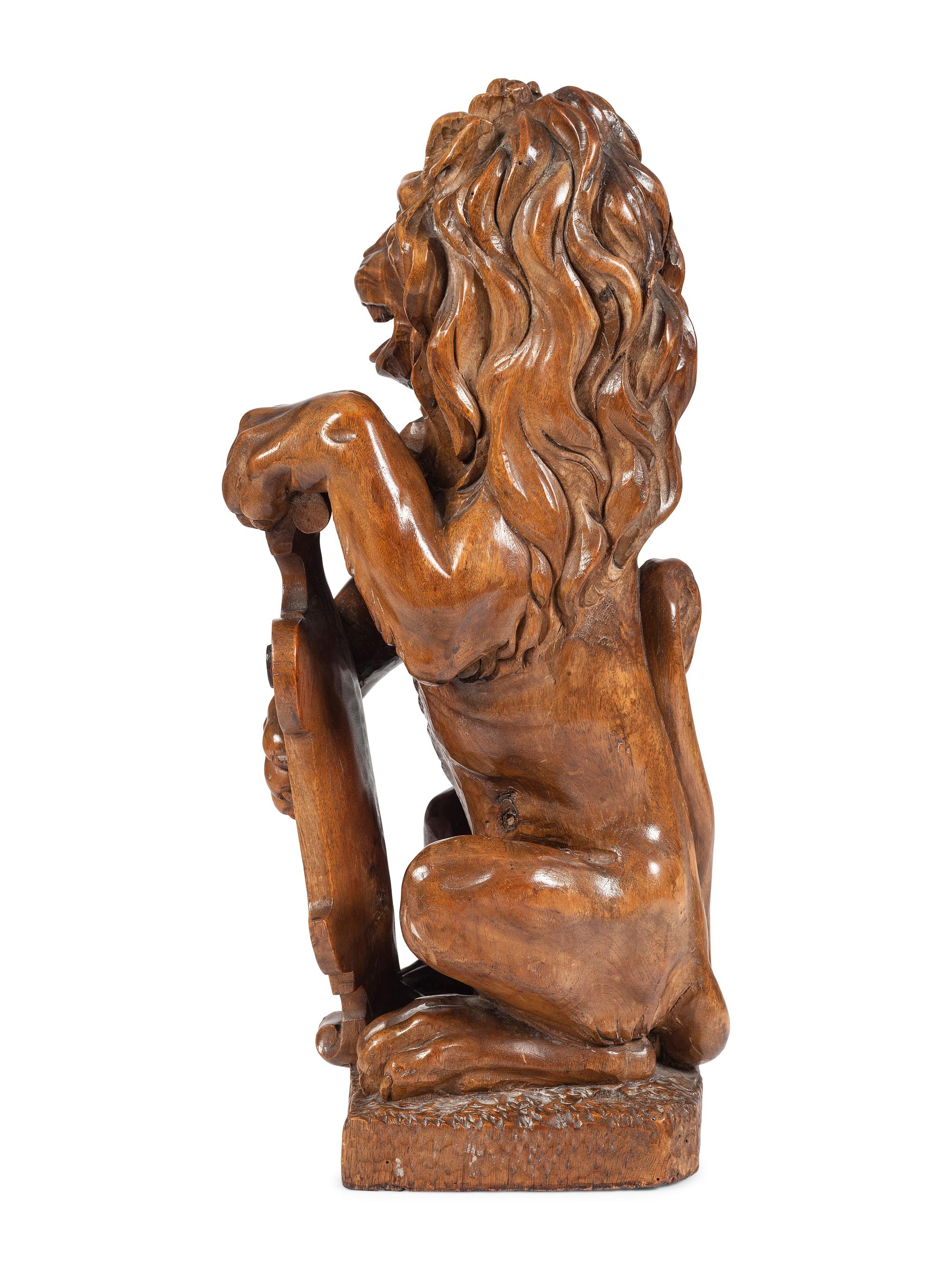 A Carved Wood Lion Newel Post Figure