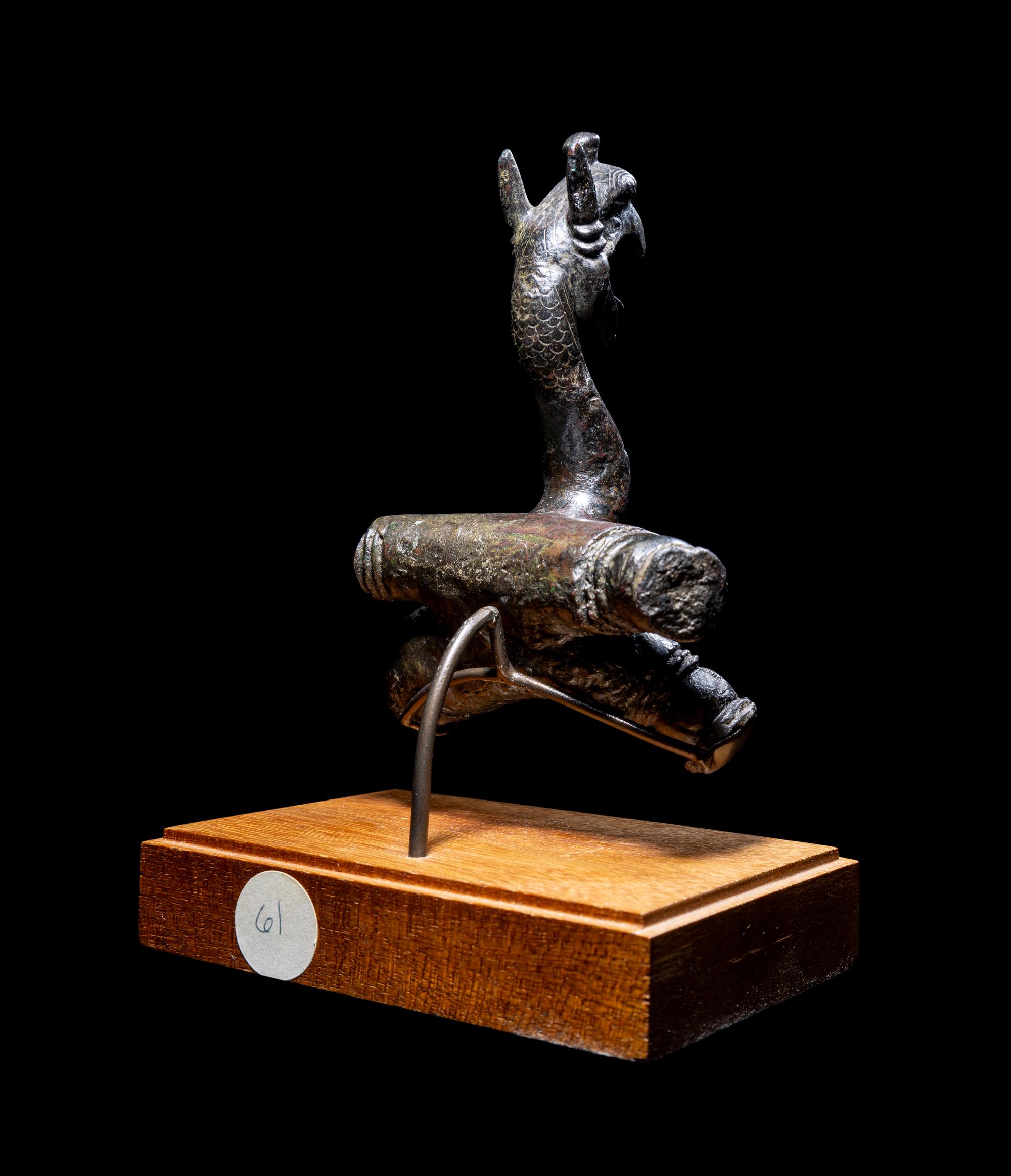 An East Greek Bronze Griffin Protome