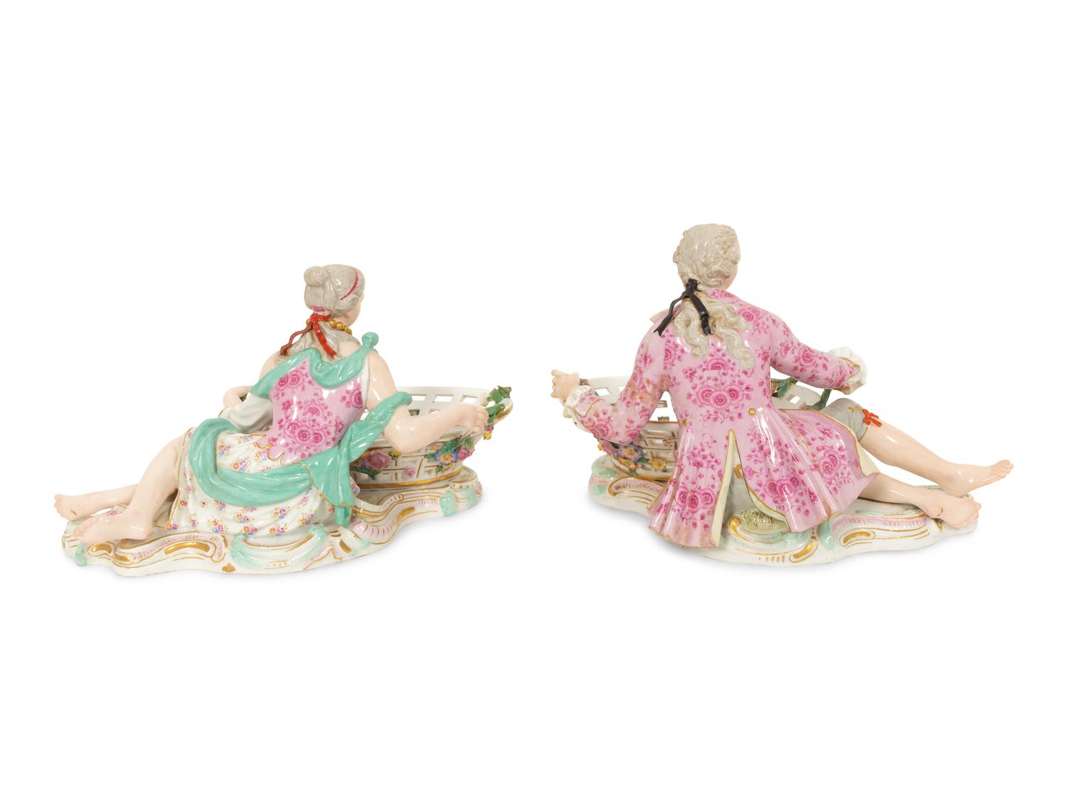 A Pair of German Porcelain Figural Sweetmeat Baskets
