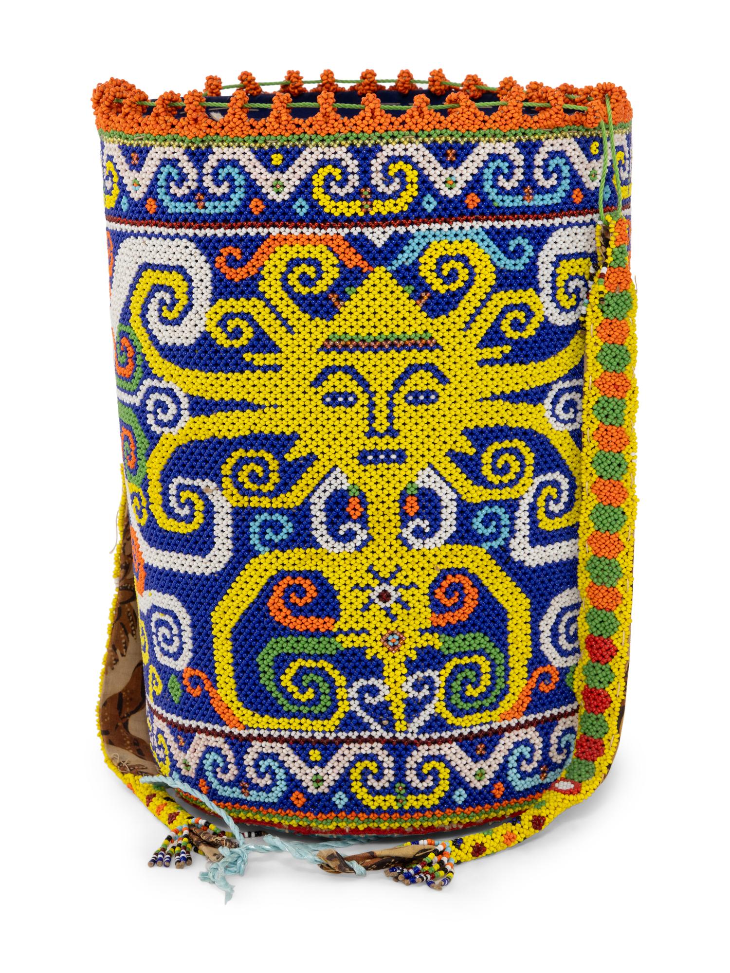 A Ndebele Doll, Two Dayak Baskets and Baby Carrier, and a Carved and Beaded Namji Doll