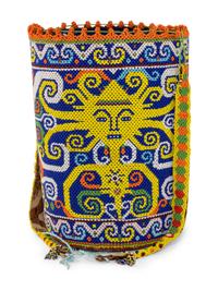 A Ndebele Doll, Two Dayak Baskets and Baby Carrier, and a Carved and Beaded Namji Doll