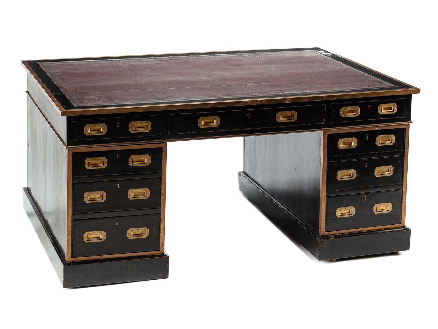 An English Brass Mounted Ebonized Partner's Desk