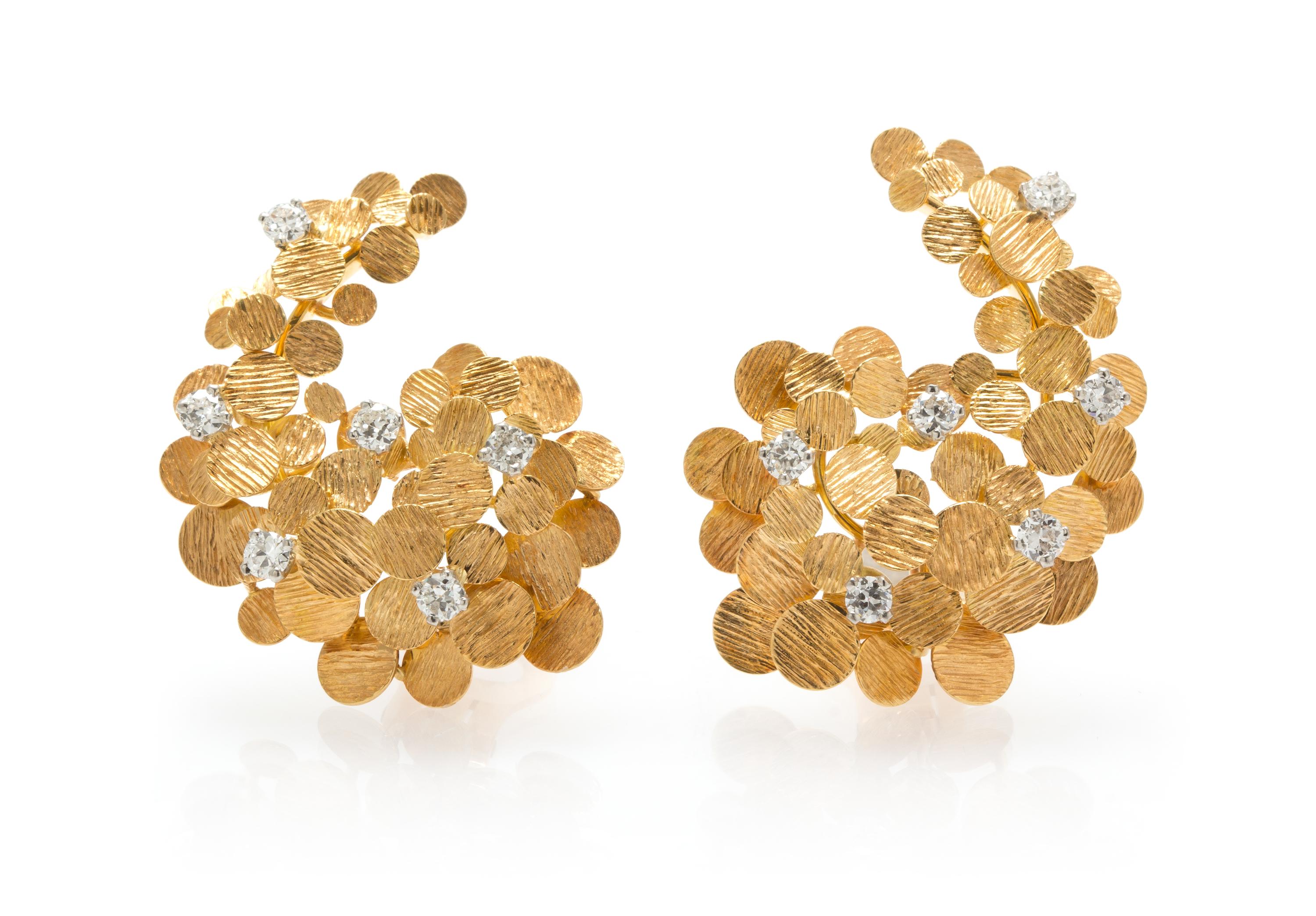 A Pair of 18 Karat Yellow Gold and Diamond Earclips, 12.70 dwts.