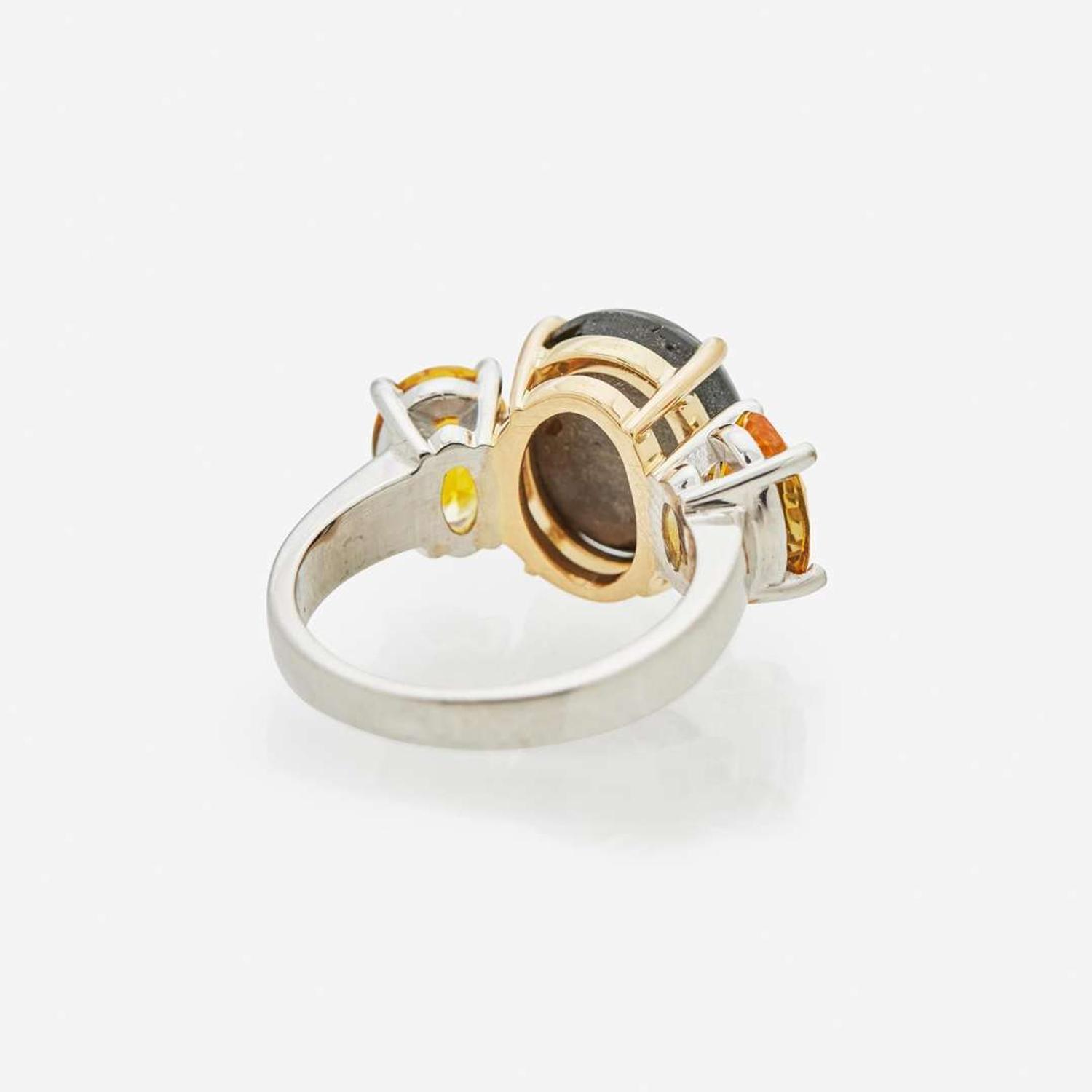 A Black Star Sapphire and Yellow Sapphire Ring