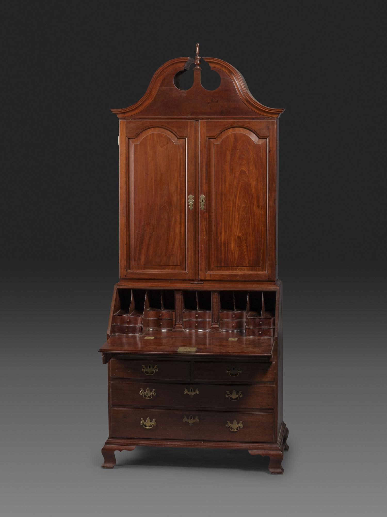 A Chippendale Figured Mahogany Bonnet Top Desk-and-Bookcase