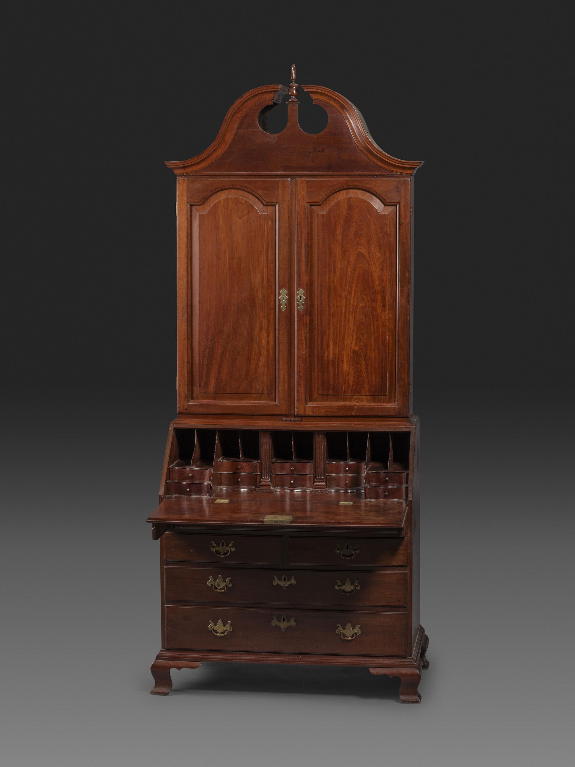 A Chippendale Figured Mahogany Bonnet Top Desk-and-Bookcase