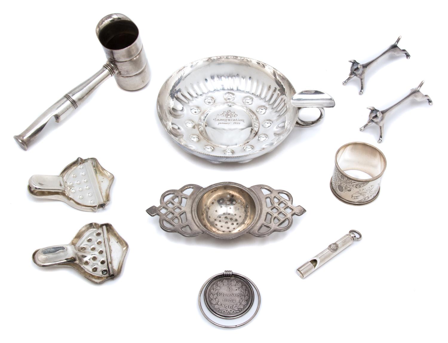 An Assembled Group of Silver-Plate and Metal Articles, , comprising: 1 Ralph Lauren whistle 1 1853 5 Franc mounted money clip 1 napkin