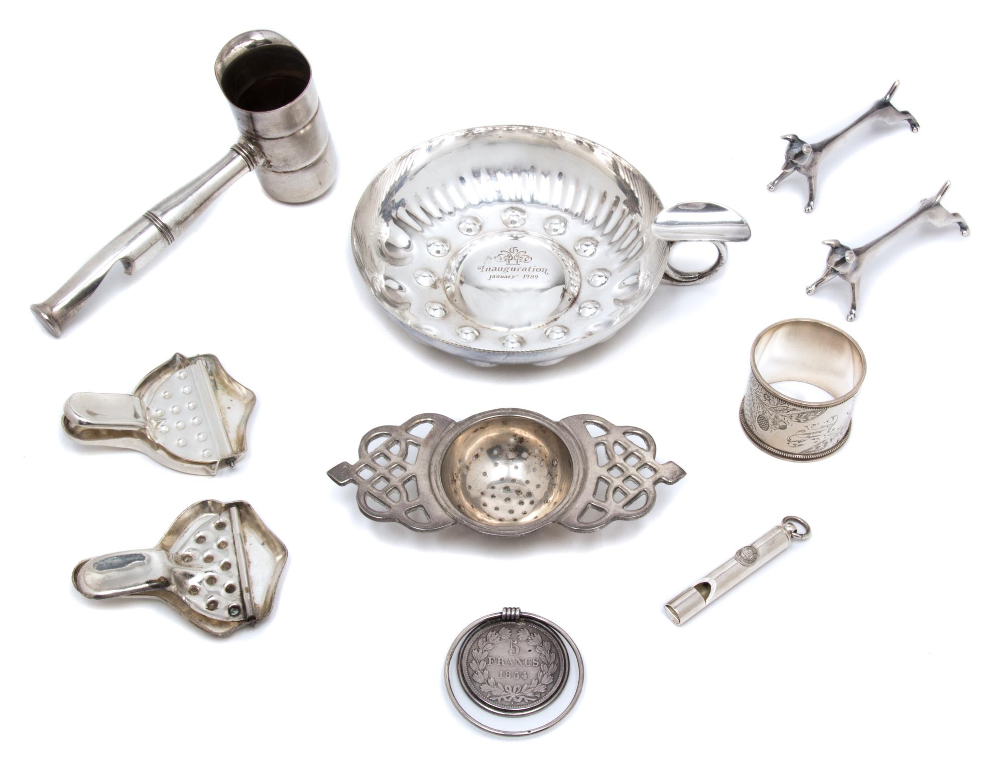 An Assembled Group of Silver-Plate and Metal Articles, , comprising: 1 Ralph Lauren whistle 1 1853 5 Franc mounted money clip 1 napkin